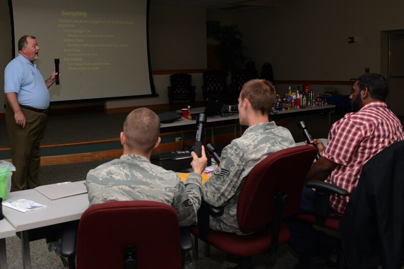 Michael George, State Alcohol Enforcement Team Liasion Pacific Institute for Research & Evaluation, instructs members of the 628th Air Base Wing Security Forces how to use a Passive Sensor Flashlight to detect alcohol during the Project Star: Safety Through Alcohol Responsiblilty training April 18, 2014, at JB Charleston – Air Base, S.C. The training is designed to decrease the number of first-time alcohol-related incidents among underage military personnel on Join Base Charleston. (U.S. Air Force photo/ Airman Basic Chacarra Neal) 