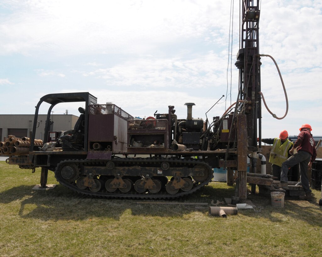 Workers from EA Engineering P.C. and its affiliate EA Science and Technology are drilling monitoring wells and soil borings at the Niagara Falls Air Reserve Station, N.Y. on April 21, 2014. The contractor is preforming a pre design investigation to help reduce environmental contamination. (U.S. Air Force photo by Peter Borys)