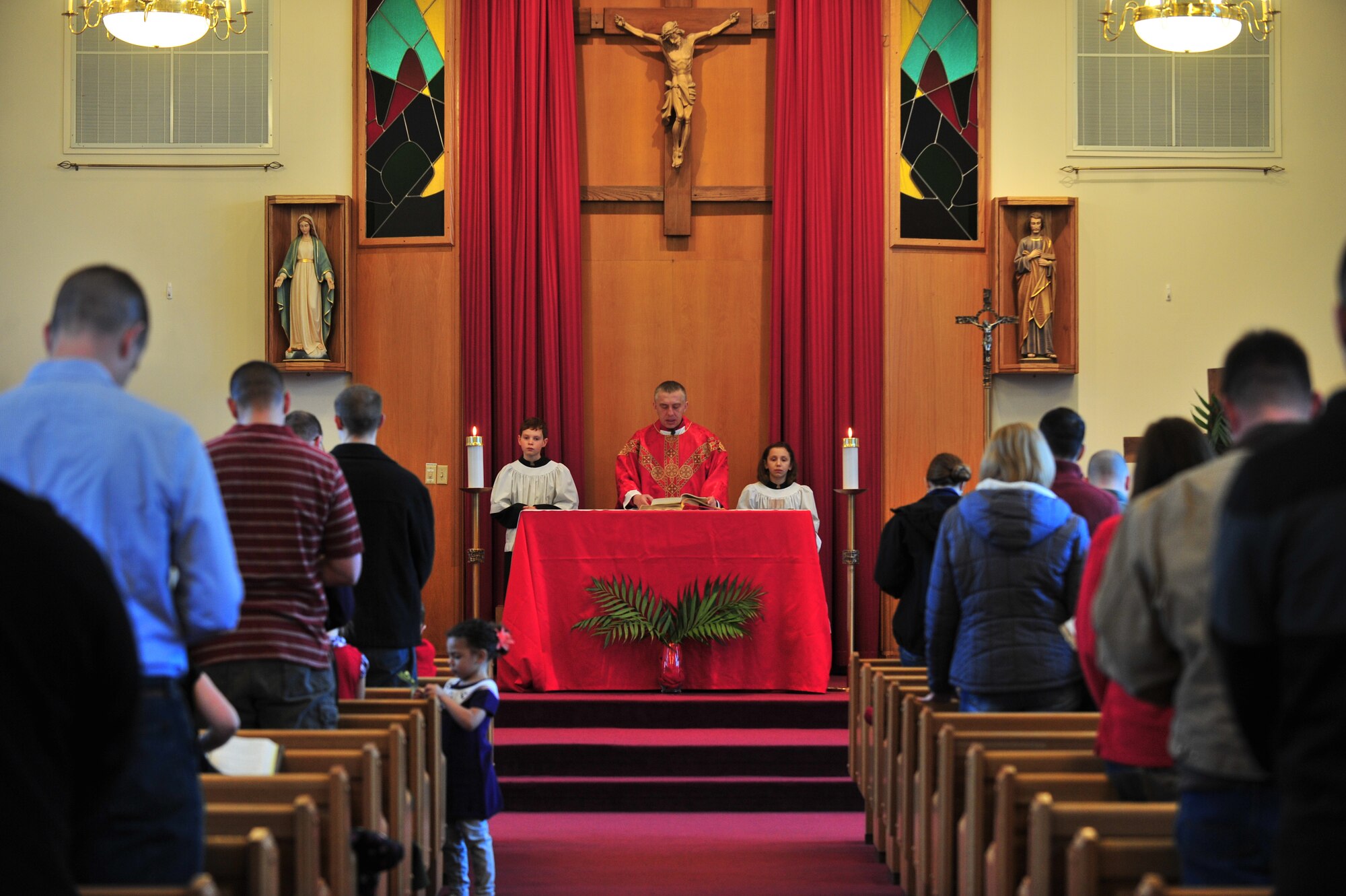 U.S. Air Force Chaplain (Capt.) Piotr Gajda, 5th Bomb Wing Catholic chaplain, leads mass at Minot Air Force Base, N.D., April 14, 2014. Chaplains work hard to help people directly, but they also assist Airmen with their presence itself. They also believe the simple act of being hands-on and doing what they do can make them a source of comfort. (U.S. Air Force photo/Senior Airman Malia Jenkins)