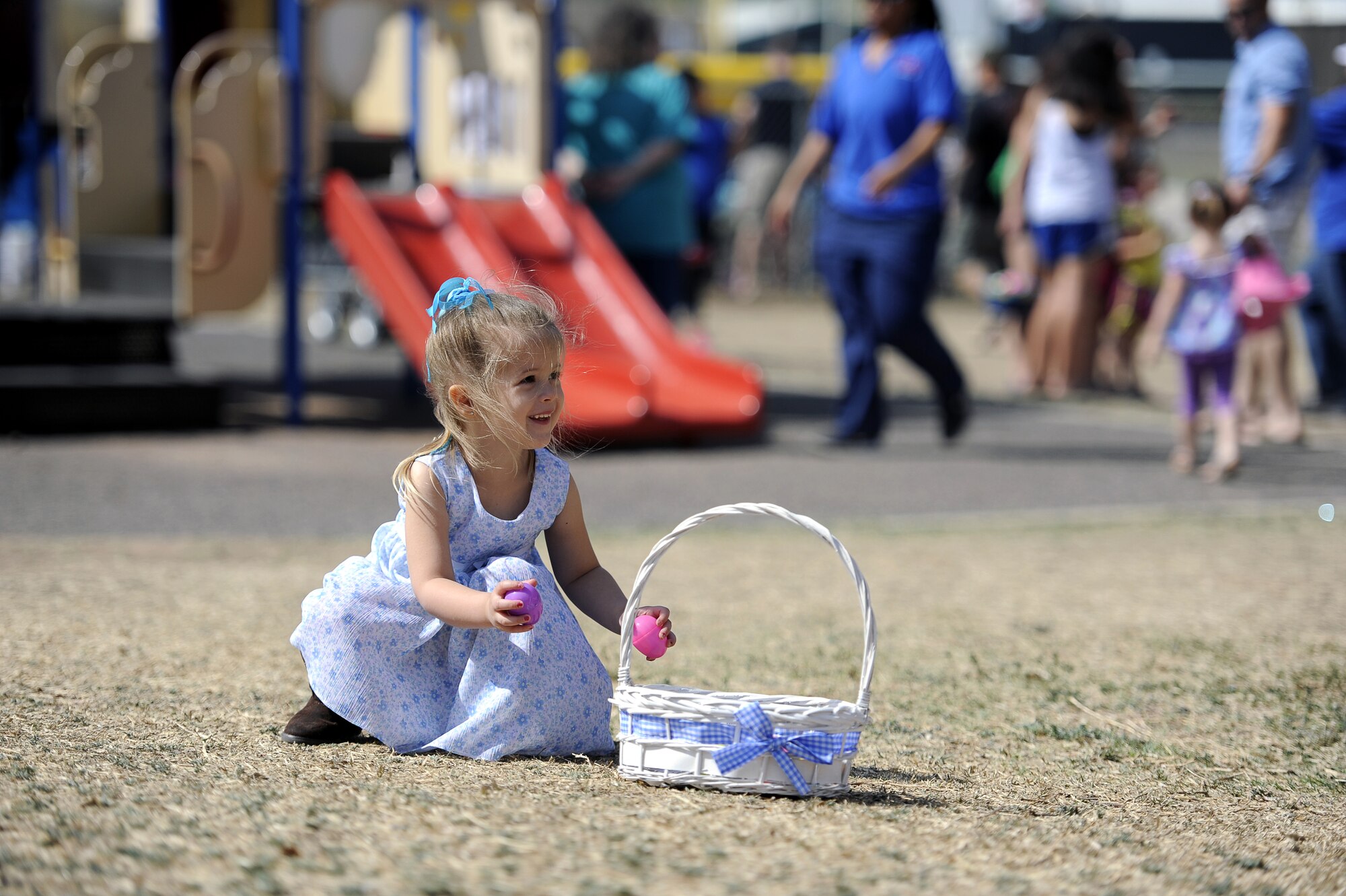 GOODFELLOW AIR FORCE BASE, Texas-- A Spring Fling participant gathers Easter Eggs during the Month of the Military Child Spring Fling egg hunts here April 12. The Month of the Military Child is every April and recognizes the accomplishments and resilience of military children by providing special days and events to honor them and their families. (U. S. Air Force photo/ Staff Sgt. Austin Knox)