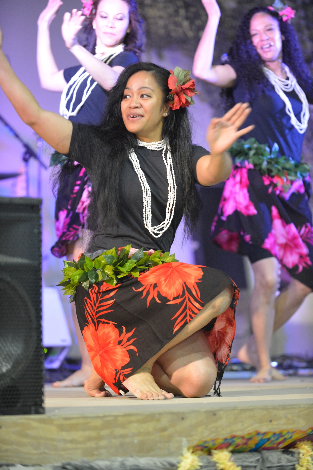 U.S. Air Force Senior Airman Desirae Faasavalu performs in a hula dancing demonstration at Bagram Airfield, Afghanistan, April 12, 2014. Faasavalu is a native of American Samoa, with a background in Polynesian island dancing history.(U.S. Air Force photo by Senior Master Sgt. Gary J. Rihn/Released)
