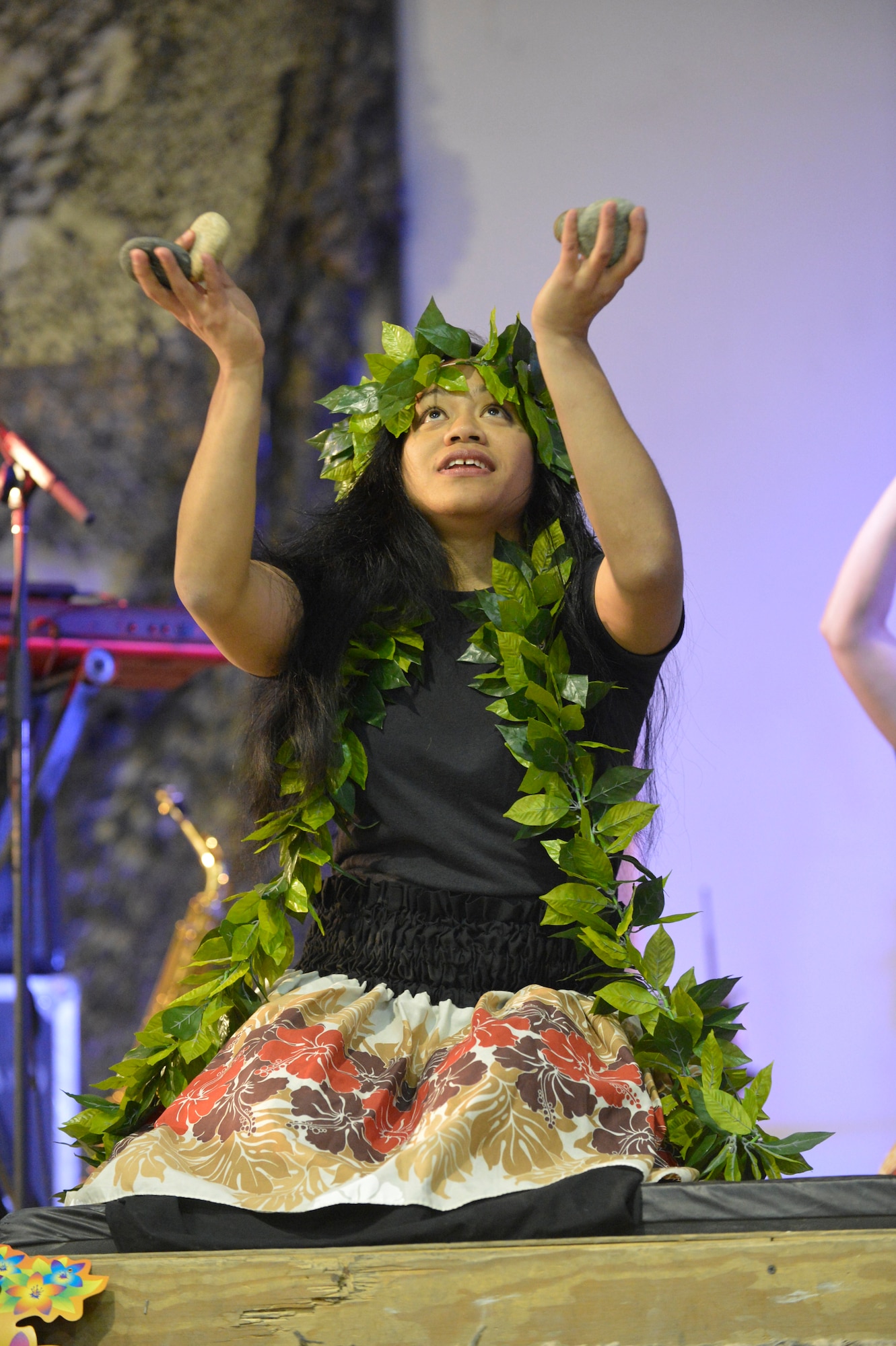 U.S. Air Force Senior Airman Desirae Faasavalu performs in a hula dancing demonstration at Bagram Airfield, Afghanistan, April 12, 2014. Faasavalu is a native of American Samoa, with a background in Polynesian island dancing history.(U.S. Air Force photo by Senior Master Sgt. Gary J. Rihn/Released)
