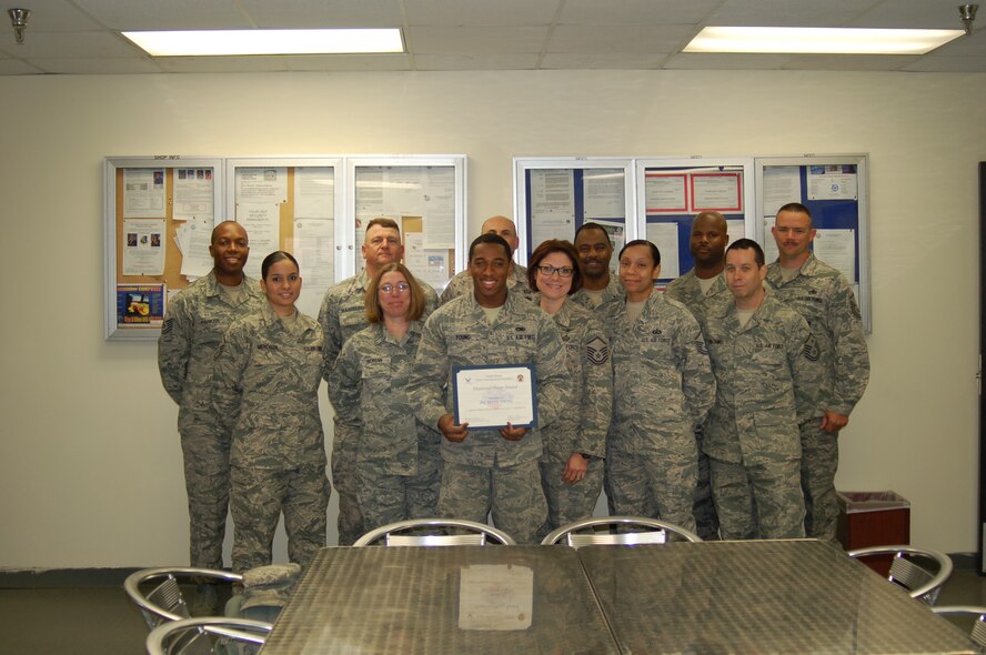 Airman 1st Class Tevin Young, 20th Component Maintenance Squadron aircraft fuel systems journeyman, is recognized by members of the Shaw First Sergeants Council as "Diamond Sharp." Diamond Sharp, the First Sergeant Council’s newly adopted program, aims to recognize two Airmen from across Shaw Air Force base monthly. (Courtesy photo)