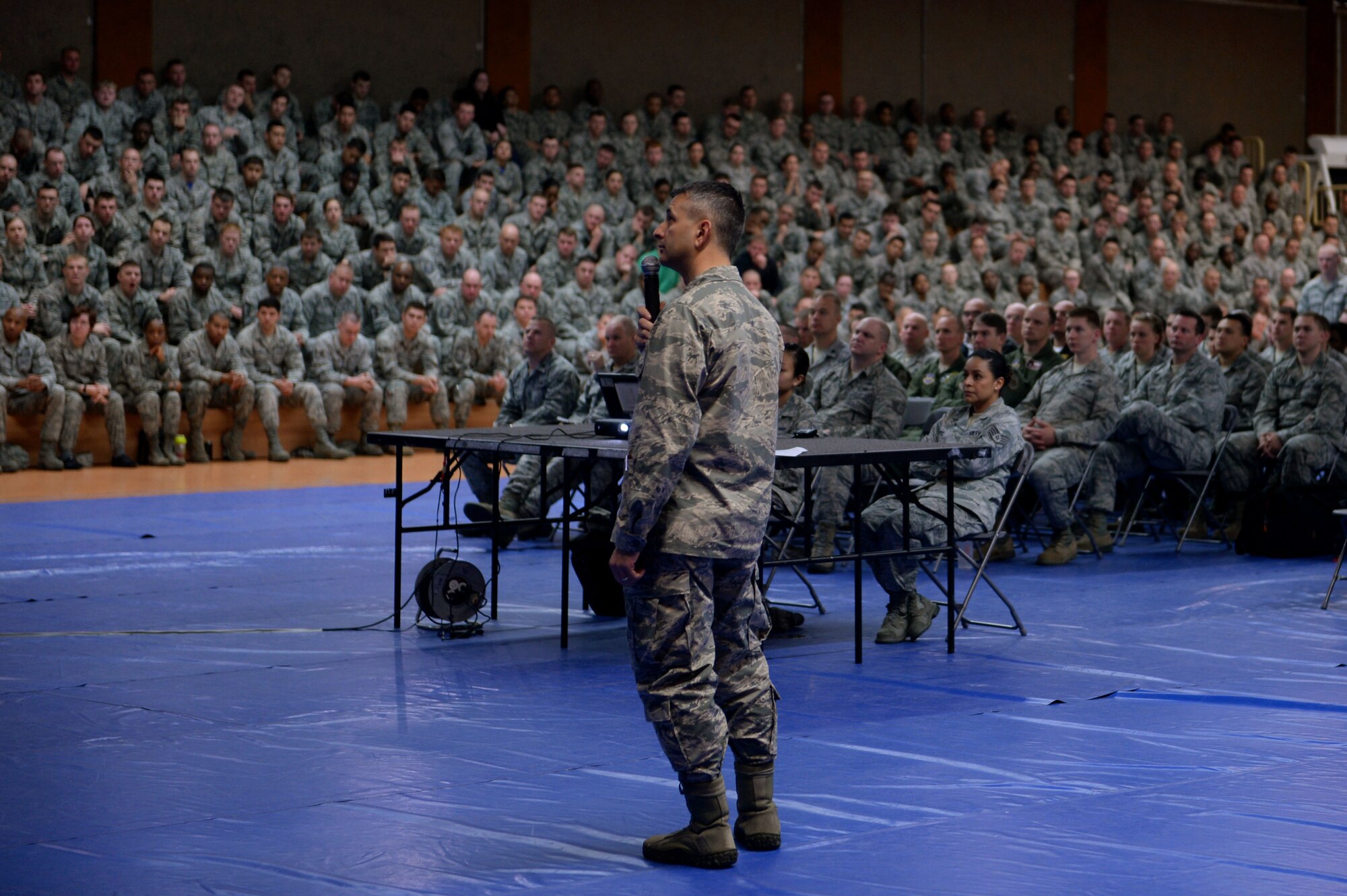 U.S. Air Force Col. David Julazadeh, 52nd Fighter Wing commander, holds an all call at the Skelton Memorial Fitness Center on Spangdahlem Air Base, Germany, April 18, 2014. Julazadeh spoke of stepping in as a bystander and how to identify the behavior of a potential perpetrator. (U.S. Air Force photo by Senior Airman Alexis Siekert/Released)