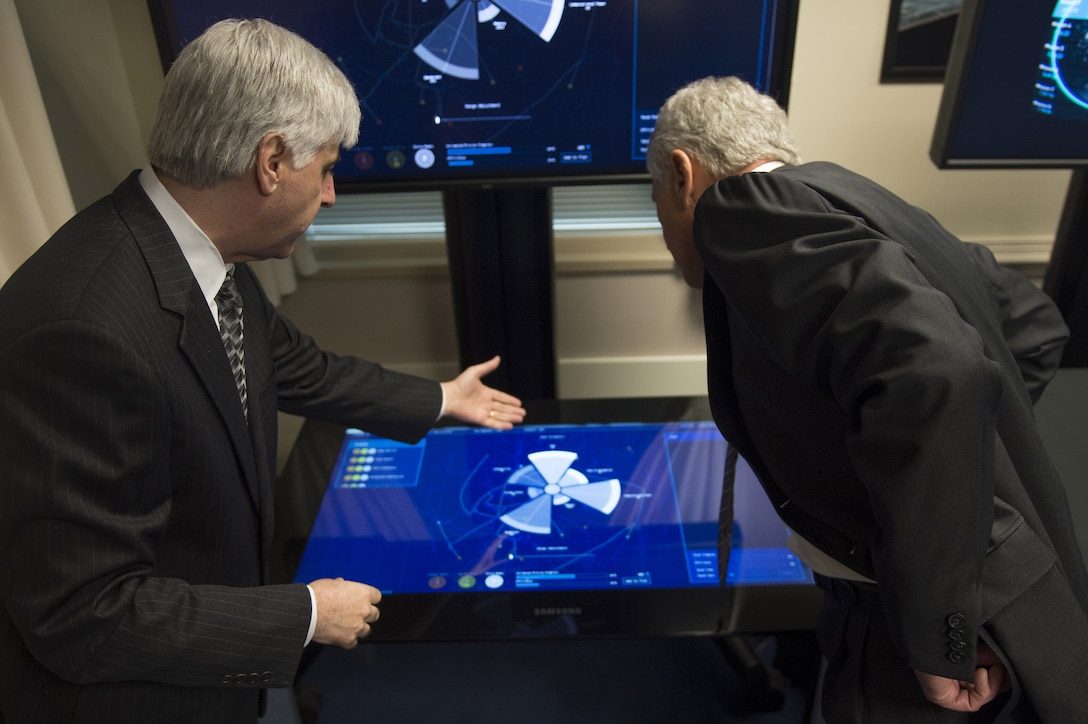 Defense Secretary Chuck Hagel learns about Plan X during a demonstration by the Defense Advanced Research Projects Agency, or DARPA, at the Pentagon, April 22, 2014. Plan X is a program that develops platforms for the Defense Department to assess cyberwarfare in a manner similar to kinetic warfare.