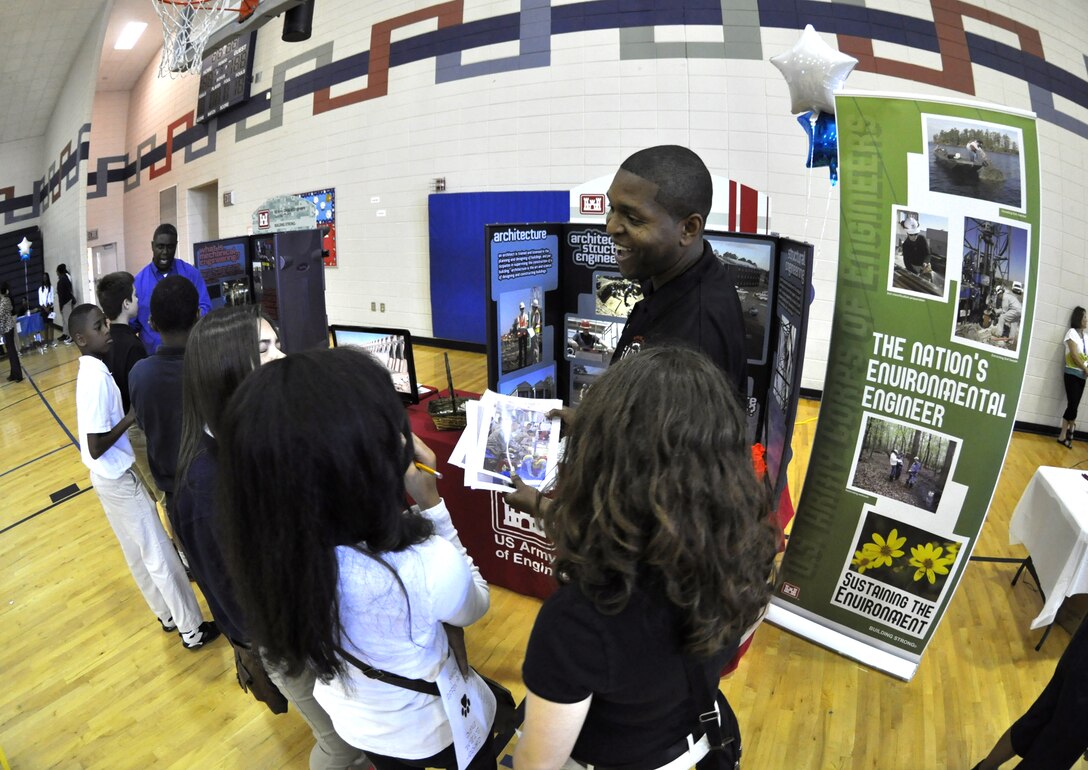 MIDWAY, Ga. – Members of the U.S. Army Corps of Engineers Savannah District participated in a STEM Career Expo at Midway Middle School to encourage more than 800 students to pursue careers in Science, Technology, Engineering and Math (STEM). April 22, 2014. Corps team members Reggie Terry and Andre Wright (pictured) from the Fort Stewart field office talked to kids about jobs available in the Corps of Engineers. 