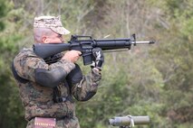 Staff Sgt. Benjamin J. Lacasse, tower staff noncommissioned officer with Headquarters Battalion, Marine Corps Air Station Kaneohe Bay, Hawaii, Pacific Division Team, fires the National Match M16A4 service rifle with iron sights at the 200-yard line during the individual rifle portion of the 2014 Marine Corps Match Championships from April 14-16 aboard the Weapons Training Battalion ranges at Stone Bay. West is one of 84 competitors, and they competed in three different categories. The individual rifle match, the individual pistol match and the team rifle and pistol match. The individual rifle match and team match are shot from the 200-yard line, 300-yard line and 600-yard line. The match rifle weighs approximately 17 pounds, with a stainless steel barrel with both weighted hand guards and butt stock. During competition marksmanship, competitors are supplied with unique shooting jackets and non-slip leather rifle slings that provide additional stability, and long-distance scouting scopes to sight shots at distances more than 600 yards. (U.S. Marine Corps photo by Sgt. Alicia R. Leaders/Released)