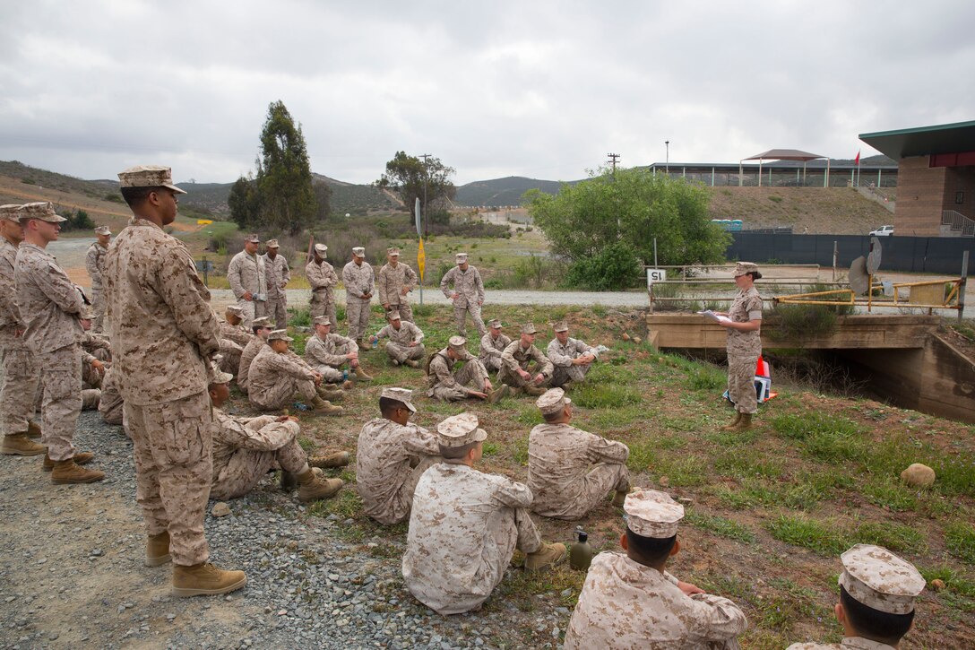 MARINE CORPS AIR STATION MIRAMAR, Calif. – Marines with Headquarters and Headquarters Squadron participate in a sexual assault prevention and response class at Carlos Hathcock Range aboard Marine Corps Air Station Miramar, Calif., April 18. The Marines hiked two miles before receiving the class and then hiked three additional miles back. 
