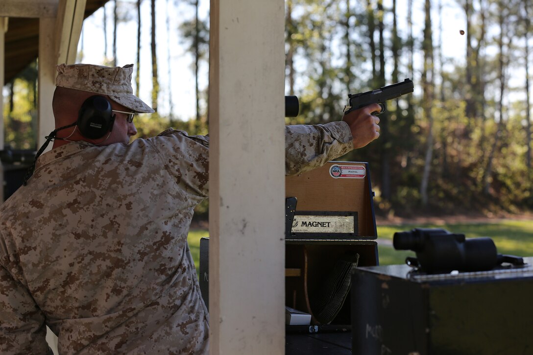 Capt. Stanley C. Wisniewski, Marine Corps Recruit Depot Parris Island, S.C., shooting team officer in charge, Eastern Division Team, fires the National Match M1911 .45 caliber service pistol one-handed, during the pistol team match portion of the 2014 Marine Corps Match Championships, April 16, aboard the Weapons Training Battalion ranges at Stone Bay. Eighty-four competitors competed in the championships in three different categories. The individual rifle match, the individual pistol match and the team rifle and pistol match. (U.S. Marine Corps photo by Sgt. Alicia R. Leaders)