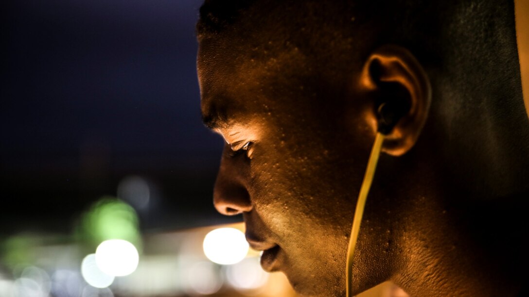 Private First Class D’Vonte Robinson, administrative specialist, 15th Marine Expeditionary Unit, relaxes after work by listening to music aboard Camp Pendleton, Calif., April 13, 2014. Robinson, 18, is from Montgomery, Ala. 