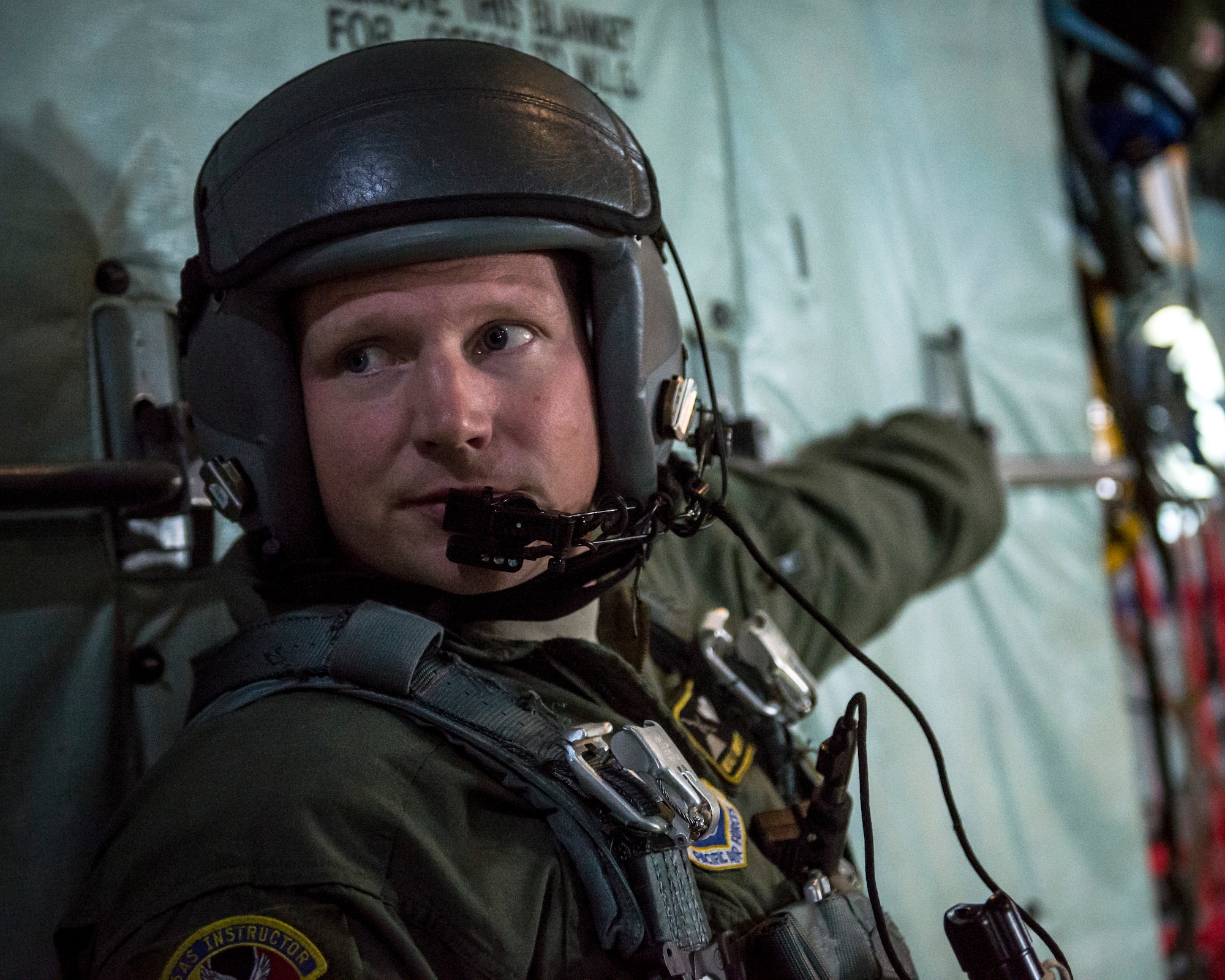 Master Sgt. Christopher Peters, 36th Airlift Squadron loadmaster, communicates with aircrew aboard a Yokota Air Base C-130H Hercules before an airdrop over the Republic of Korea, April 18, 2014. Yokota Airmen flew several airlift sorties in support of the Max Thunder exercise and to enhance their joint and allied interoperability in a simulated regional contingency. (U.S. Air Force photo by Capt. Raymond Geoffroy/Released)