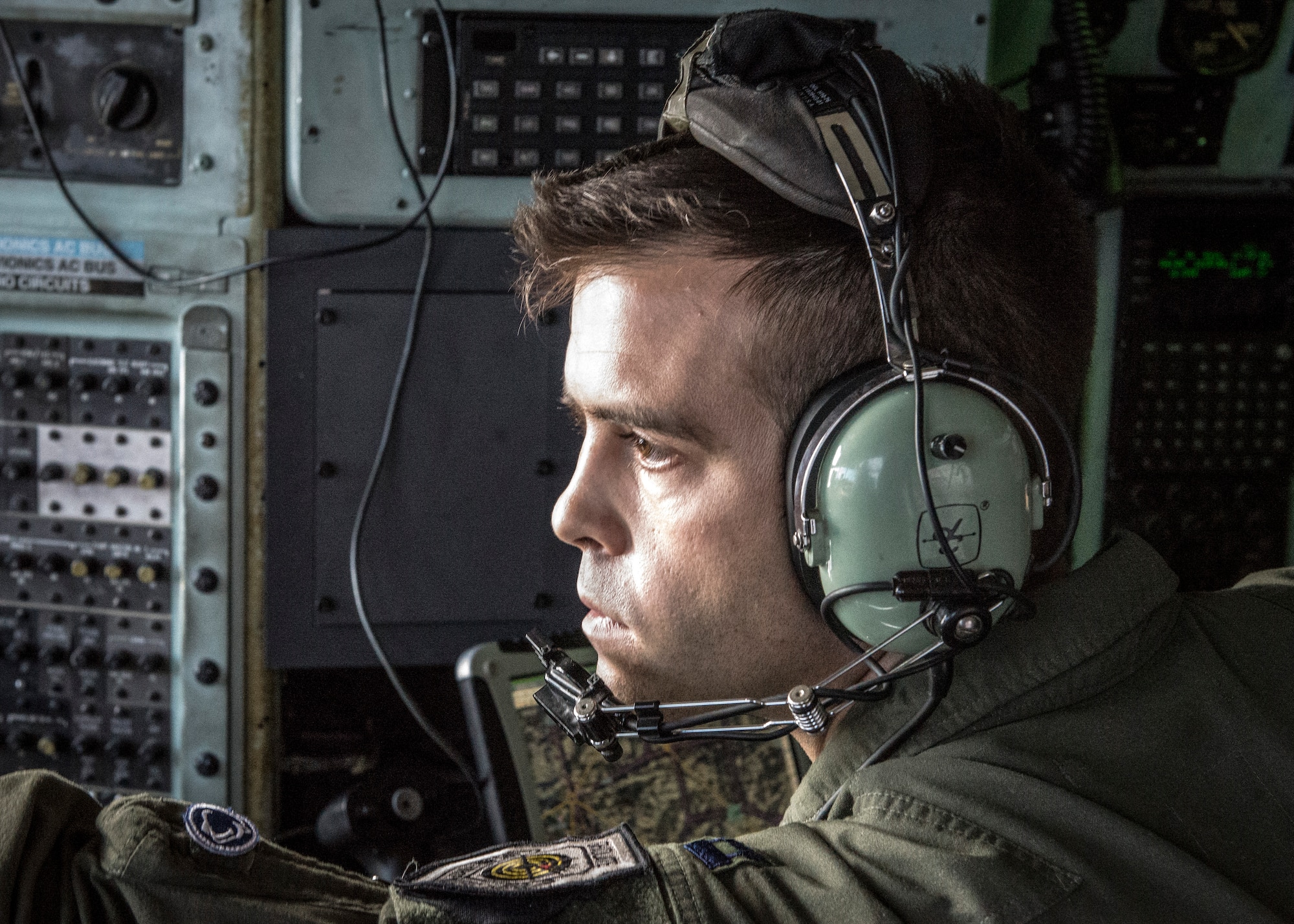Capt. Matthew Andrews, 36th Airlift Squadron navigator, prepares to deploy defensive countermeasures against a simulated surface-to-air missile threat during the Max Thunder exercise over the Republic of Korea, April 18, 2014. Max Thunder is a bilateral air exercise designed to improve interoperability between regional air assets during contingency operations. (U.S. Air Force photo by Capt. Raymond Geoffroy/Released)
