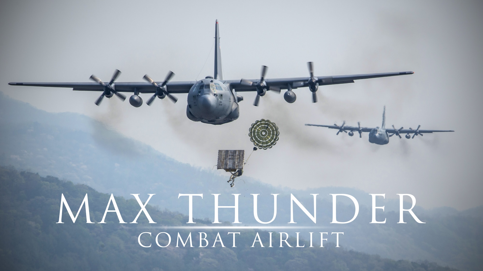 Yokota Air Base C-130H Hercules drop heavy equipment payloads over the Republic of Korea during Exercise Max Thunder, April 18, 2014. Max Thunder is a bilateral air exercise designed to improve interoperability between regional air assets during contingency operations. (U.S. Air Force graphic by Capt. Raymond Geoffroy/Released)