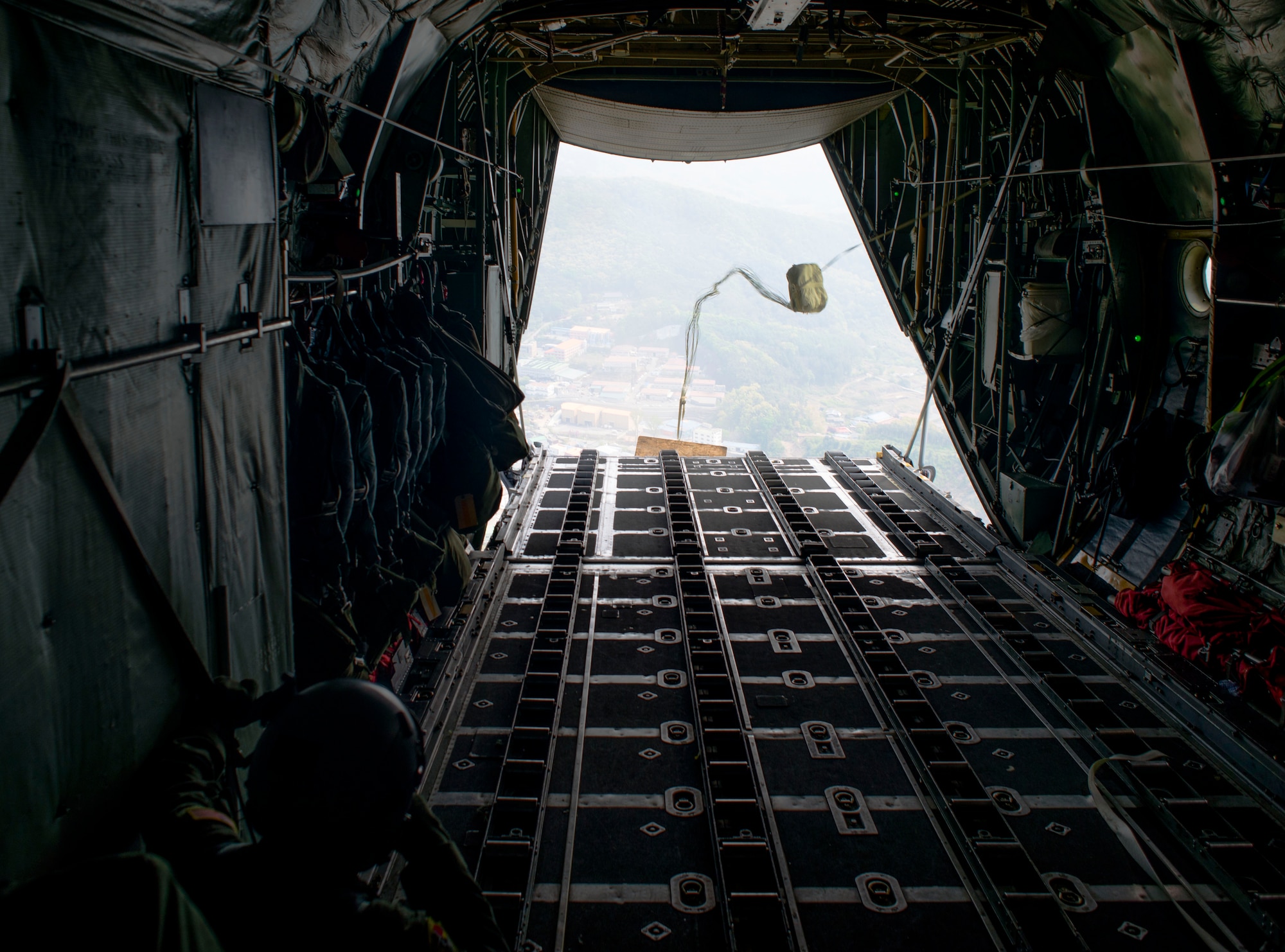 Loadmasters with the 36th Airlift Squadron deploy a low-cost, low-altitude payload in a C-130 Hercules April 23, 2014 over the Republic of Korea. The sortie took off in support of Max Thunder, a bilateral aerial training exercise that trains U.S. and Republic of Korea Air Force pilots to work closer together against a hostile force. (U.S. Air Force photo by Staff Sgt. Chad C. Strohmeyer/Released)