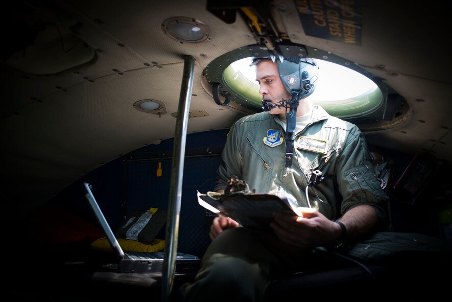 Capt. Matthew Andrews, 36th Airlift Squadron navigator, checks GPS coordinates during flight in a C-130 Hercules April 23, 2014 over Yokota Air Base, Japan. The sortie took off in support of Max Thunder, a bilateral aerial training exercise that trains U.S. and Republic of Korea Air Force pilots to work closer together against a hostile force. (U.S. Air Force photo by Staff Sgt. Chad C. Strohmeyer/Released)