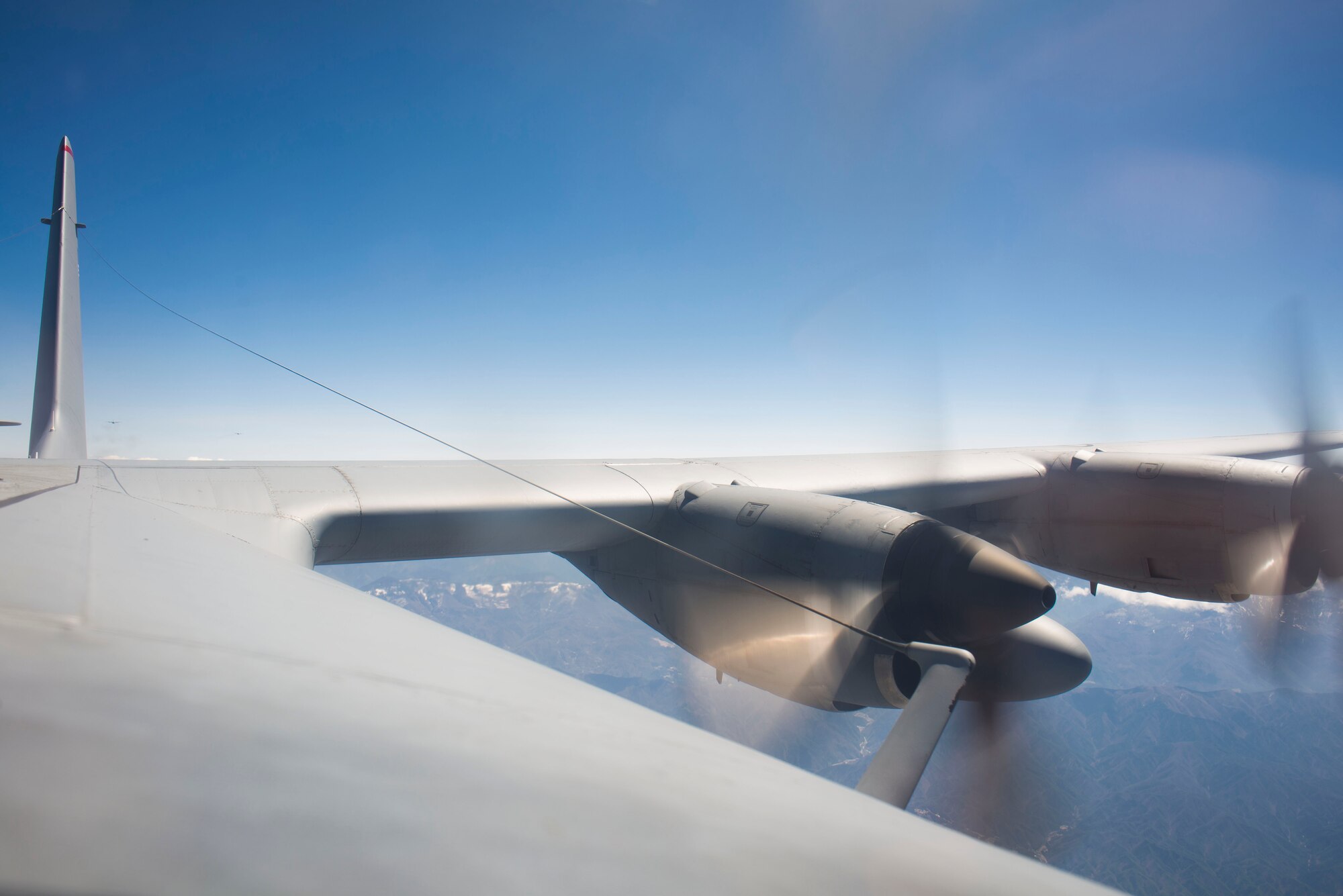 A C-130 Hercules flies over Japan April 23, 2014 over Yokota Air Base, Japan. The sortie took off in support of Max Thunder, a bilateral aerial training exercise that trains U.S. and Republic of Korea Air Force pilots to work closer together against a hostile force. (U.S. Air Force photo by Staff Sgt. Chad C. Strohmeyer/Released)