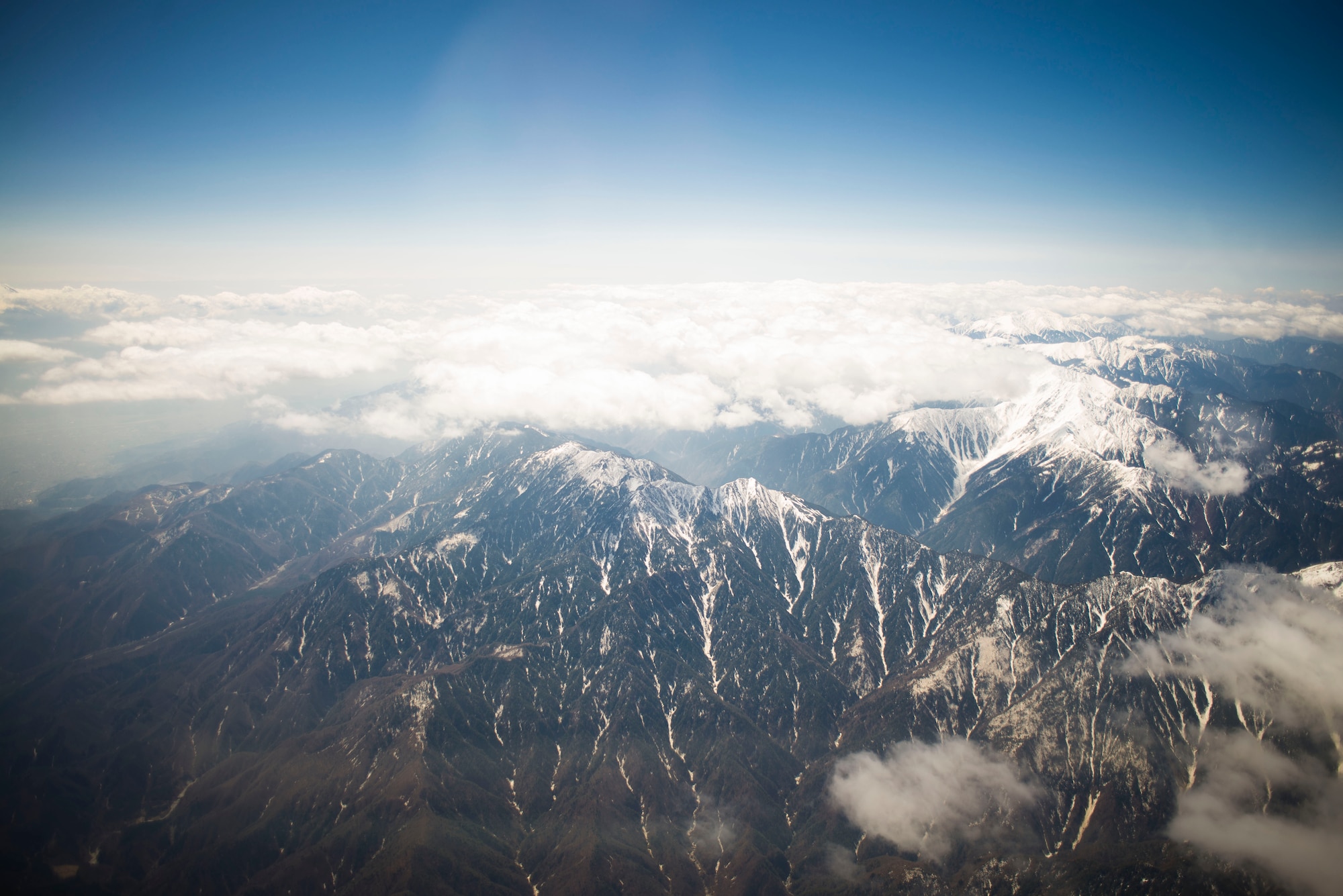 A C-130 Hercules with the 36th Airlift Squadron flies by Japanese mountain tops heading towards the Republic of Korea April 23, 2014 at Yokota Air Base, Japan.  (U.S. Air Force photo by Staff Sgt. Chad C. Strohmeyer/Released)