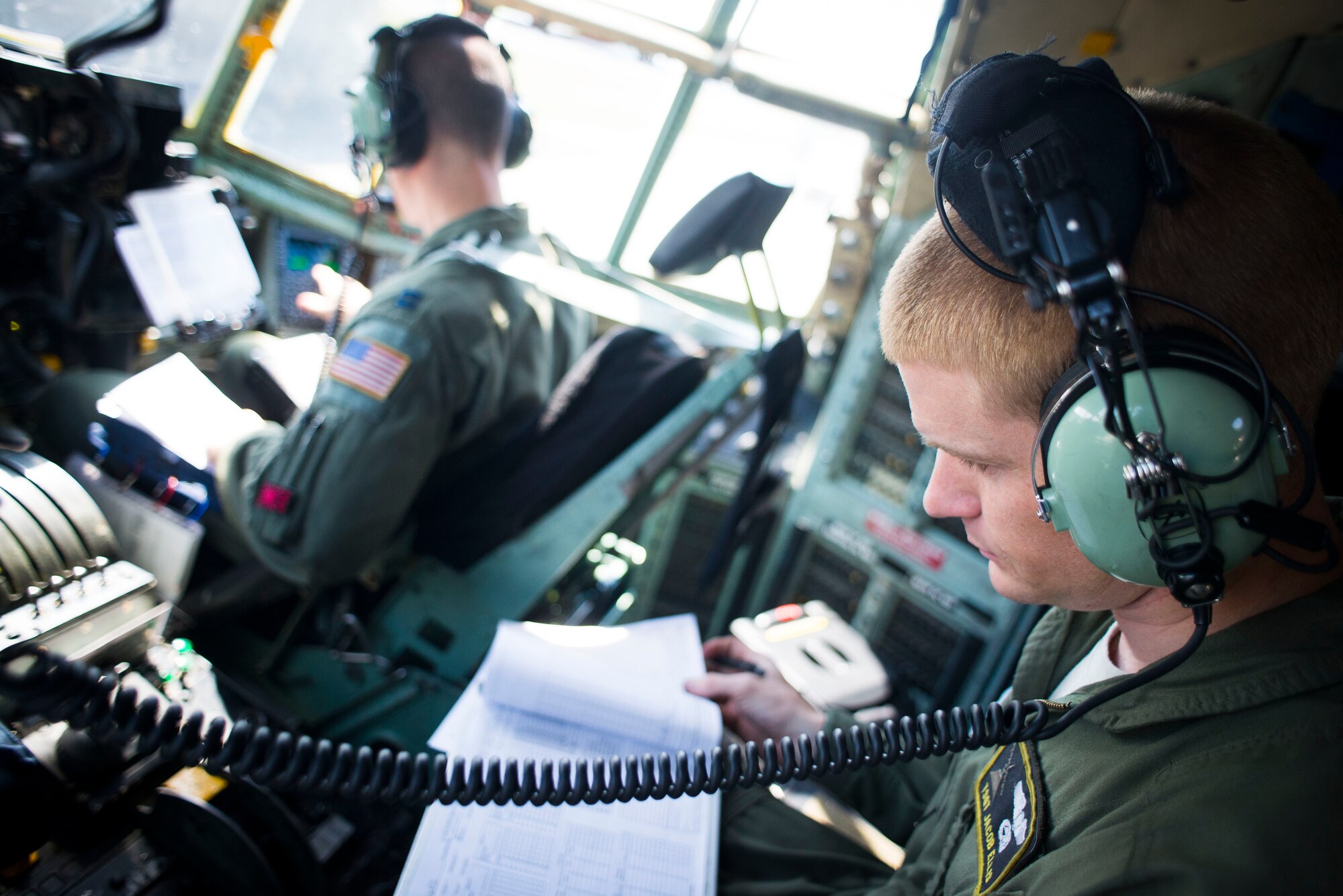 Tech. Sgt. Jacob Ellis, 36th Airlift Squadron flight engineer, conducts pre-flight checks prior to taking off in a C-130 Hercules April 23, 2014 at Yokota Air Base, Japan. The sortie took off in support of Max Thunder, a bilateral aerial training exercise that trains U.S. and Republic of Korea Air Force pilots to work closer together against a hostile force. (U.S. Air Force photo by Staff Sgt. Chad C. Strohmeyer/Released)