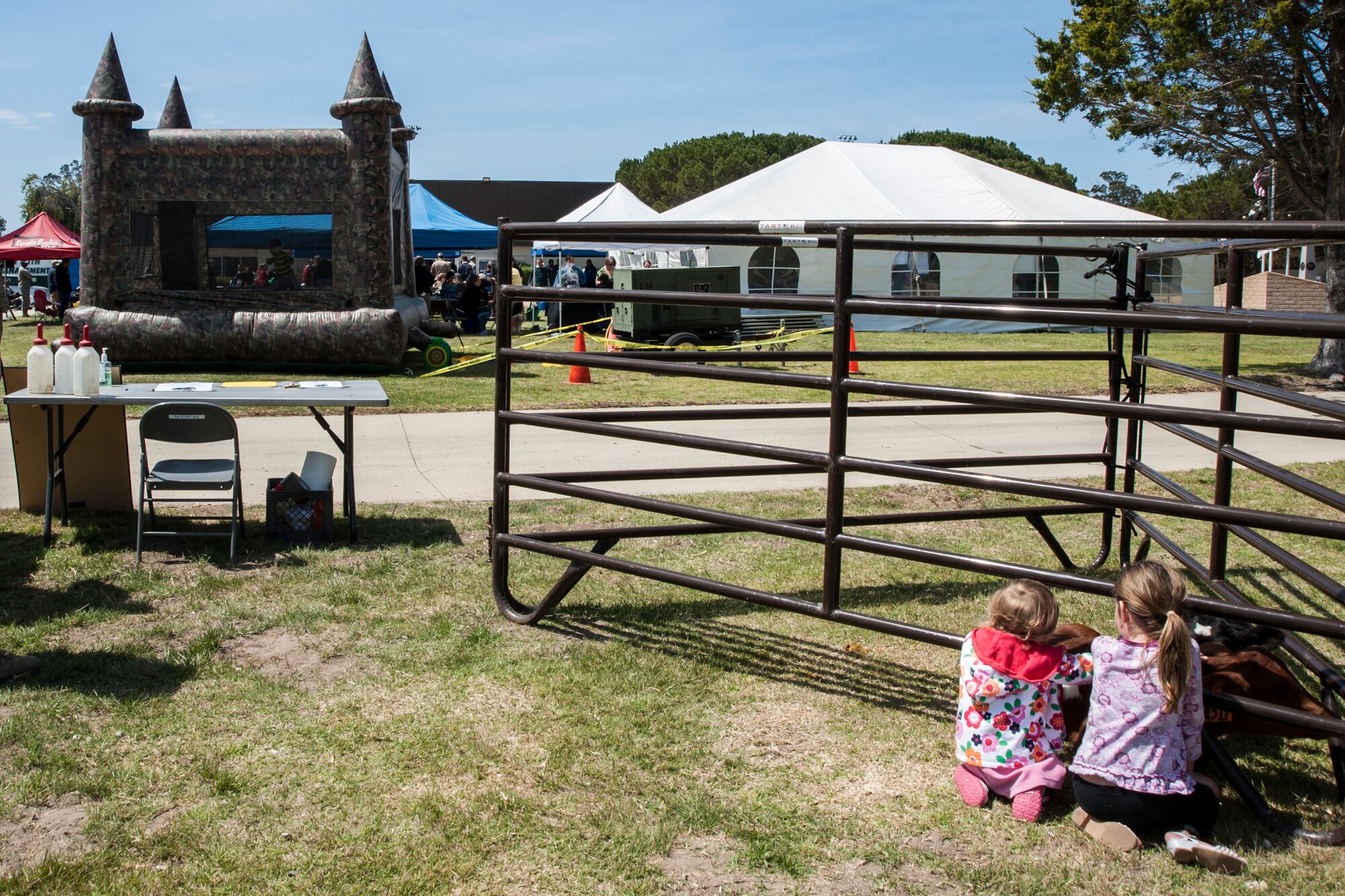 Children pet calves during the 14th Annual Earth Day celebration April 23, 2014, Vandenberg Air Force Base, Calif. The 30th Civil Engineer Squadron hosted the event that showcased Vandenberg and the surrounding communities’ efforts to be “green.” (U.S. Air Force photo/ Airman 1st Class Yvonne Morales)