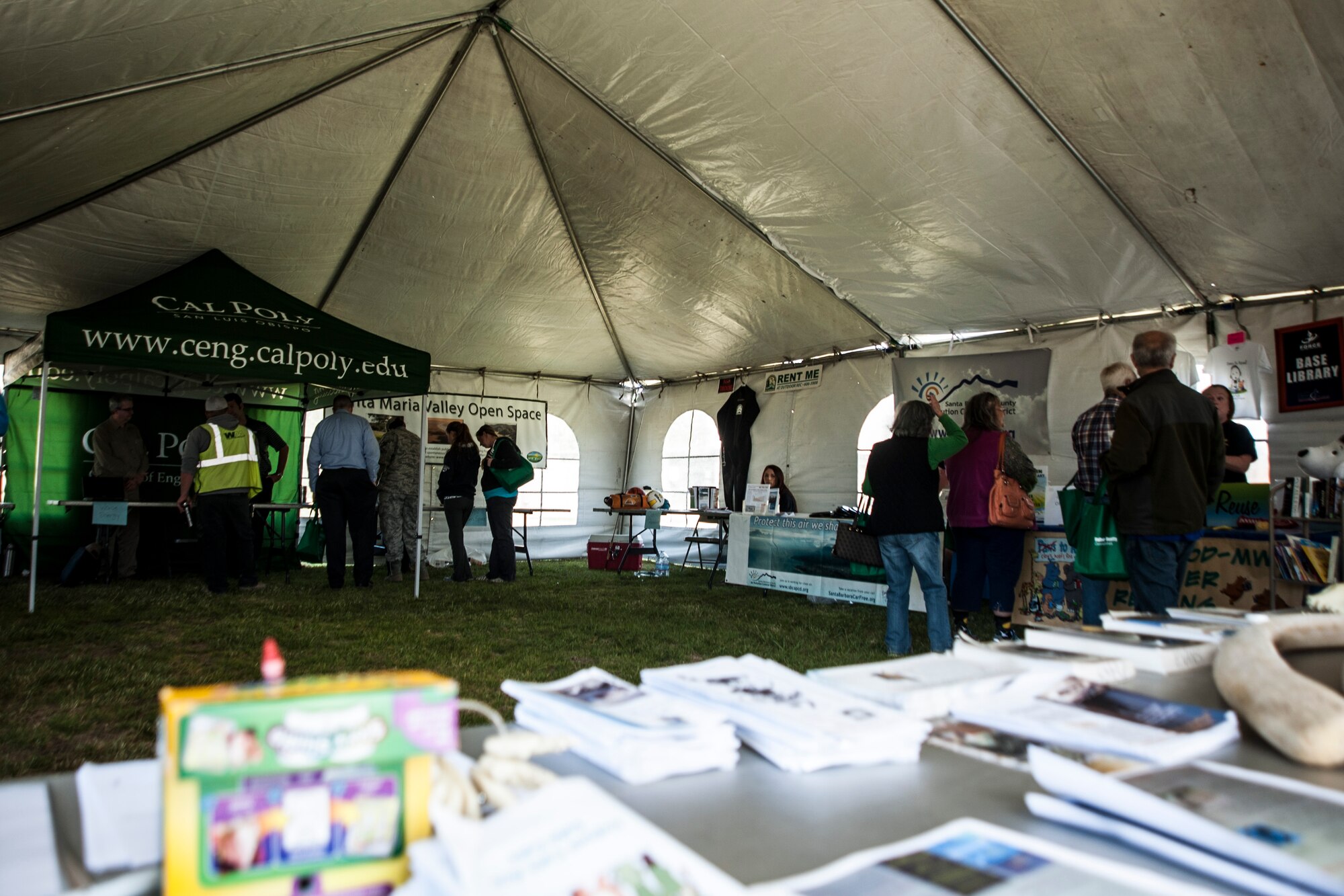 Military and families visit information booths during the 14th Annual Earth Day celebration April 23, 2014, Vandenberg Air Force Base, Calif. The 30th Civil Engineer Squadron hosted the event that showcased Vandenberg and the surrounding communities’ efforts to be “green.” (U.S. Air Force photo/ Airman 1st Class Yvonne Morales)