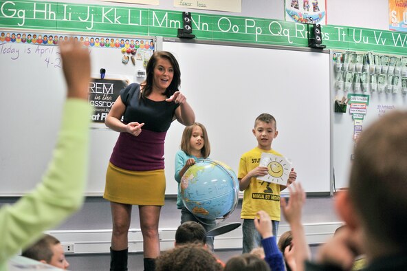 Katie Boer calls on a student from Michael Anderson Elementary at Fairchild Air Force Base, Wash., to explain how the sun and earth rotation affects our weather April 21, 2014. Boer is a KREM 2 News weather anchor for the Inland Northwest Region. She visited Michael Anderson Elementary at Fairchild AFB to teach children the science of weather and the importance of following their dreams.  (U.S. Air Force photo by Staff Sgt. Alexandre Montes/Released)