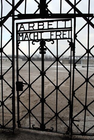 DACHAU, Germany – The gate leading into the concentration camp. The camp was designed to hold 6,000 prisoners, but by 1944, approximately 30,000 prisoners were held there.  Eventually the camp grew to include subcamps located in southern Germany and Austria.  The United States military entered Dachau April 29, 1945, and found thousands of emaciated prisoners and train cars filled with dead bodies.  More than 200,000 prisoners were registered at the camp, and thousands of others were not registered at all. There is no way to determine how many people were imprisoned there and how many died. (U.S. Air Force photo/Senior Master Sgt. Kelley J. Stewart)