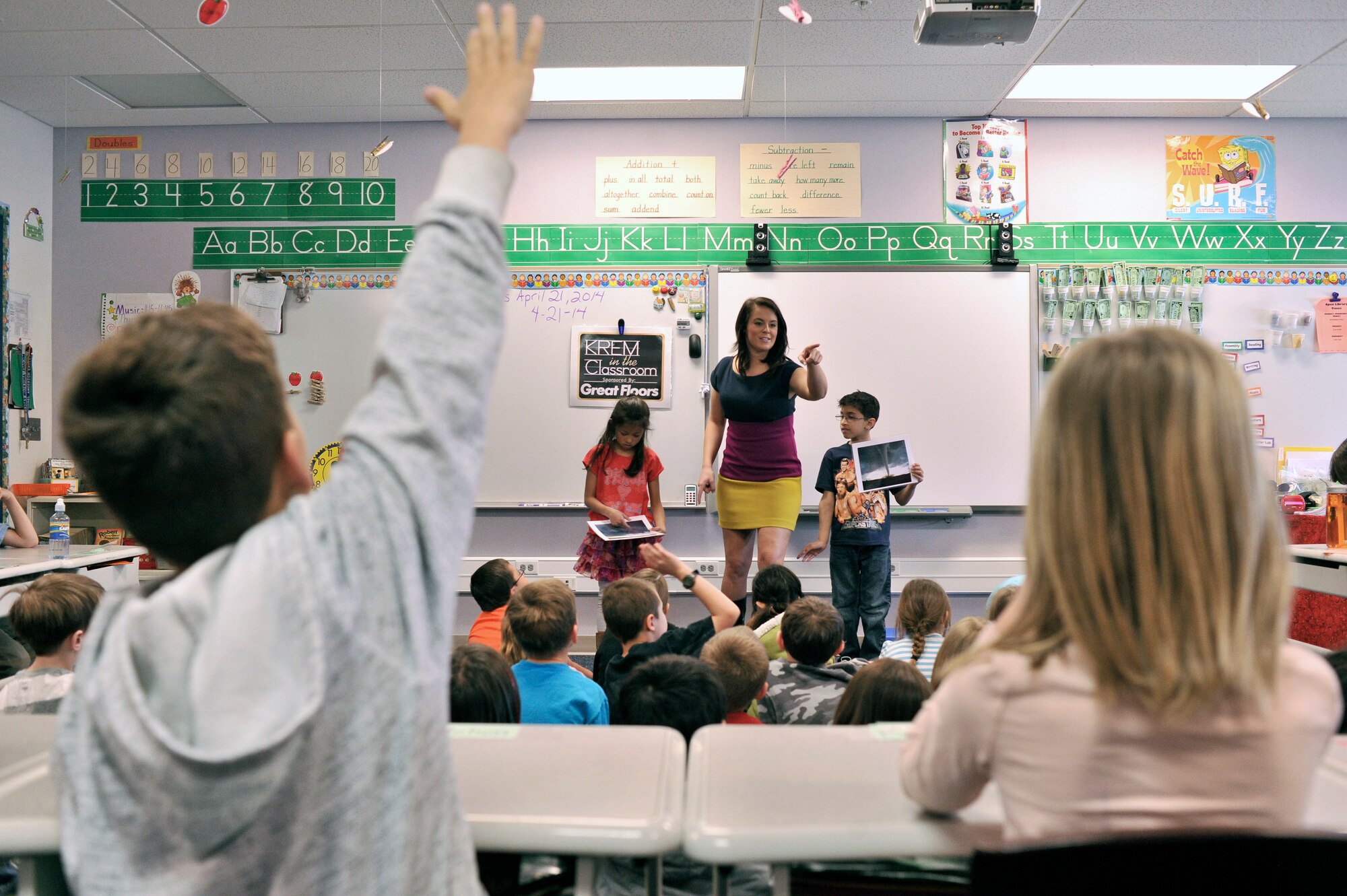 Katie Boer visits Michael Anderson Elementary at Fairchild Air Force Base, Wash., to teach children the science of weather and the importance of following their dreams April 21, 2014. Boer is a KREM 2 News weather anchor for the Inland Northwest Region. (U.S. Air Force photo by Staff Sgt. Alexandre Montes/Released)