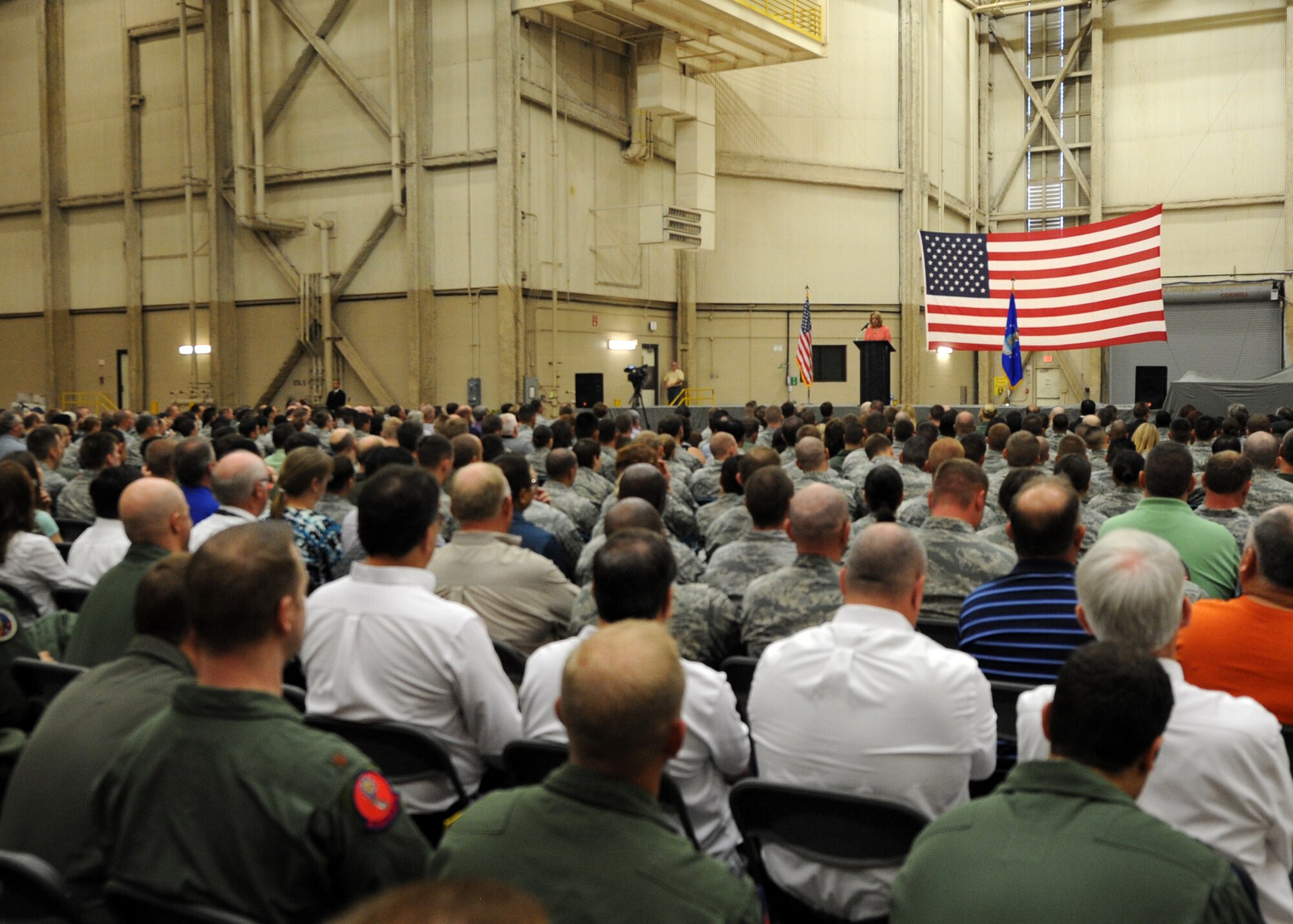 ALTUS AIR FORCE BASE, Okla. – Secretary of the Air Force Deborah Lee James speaks to members of Altus AFB during an all call held inside a hangar April 23, 2014. James spoke to base personnel about her priorities, the defense budget, core values and the basing of the U.S. Air Force refueling aircraft KC-46A Pegasus. (U.S. Air Force photo by Senior Airman Levin Boland/Released)