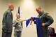 Lt. Col. Michael J. Ramirez, right, the 345th Airlift Squadron commander, cases the unit guidon during a symbolic inactivation ceremony for the squadron April 18, 2014, at Keesler Air Force Base, Miss. (U.S. Air Force photo/Master Sgt. Brian J. Lamar)