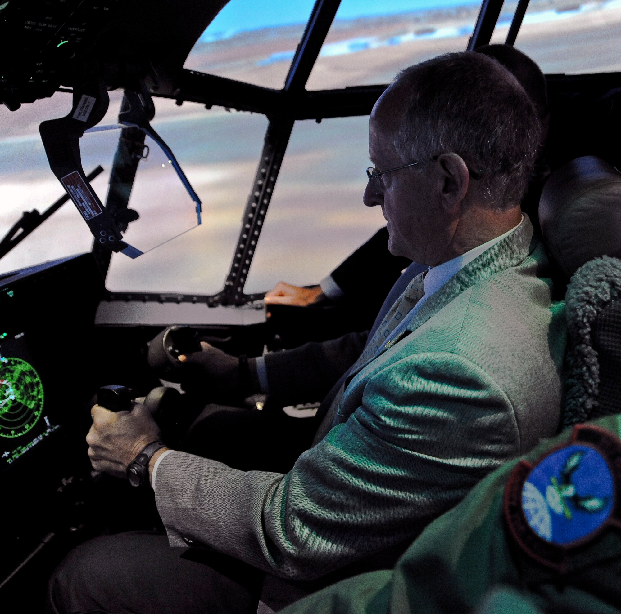 U.S. Rep. Mike Conaway operates the new C-130J Super Hercules simulator April 22, 2014, at Dyess Air Force Base, Texas. The cost to run the simulator is an estimated $850 an hour, a savings of $1,500 compared to an approximated flying cost of $2,300 an hour, which will allow the 317th Airlift Group to save an approximate $3 million annually. Additionally, the simulator will save the 317th Airlift Group approximately $400,000 annually in personnel and travel costs by conducting required training onsite.   (U.S. Air Force photo by Airman 1st Class Kedesha Pennant/Released)