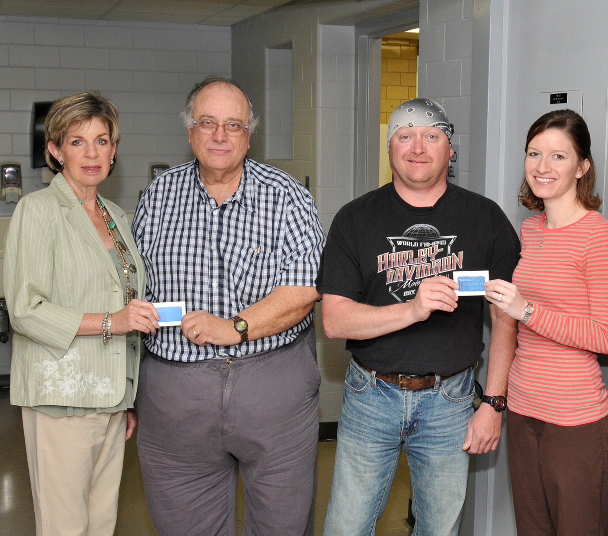 – Blood Assurance donor recruiter Vickie Shelton, left, and Comprehensive Occupational Resources medical technician for Aerospace Testing Alliance (ATA) Emily Fair, right, present gift cards to blood donors Jackie Wiseman, ATA instrument technician, and David Brackett, Jacobs Industrial Services (JIS) boilermaker. Wiseman and Brackett are two of the four randomly selected donors to receive the cards. ATA instrument technician Mark Floyd and ATA Technology and Engineering Analysis manager Dr. Ralph Jones, not shown, are the other winners. In thanking the winners for their donation, Shelton noted that there is a more important reason to donate blood than a chance to win one of the four Blood Assurance gift cards: Each donation can save up to three lives of patients in local hospitals. Fair extended thanks to all 55 personnel who signed up. (Photo by Rick Goodfriend)
