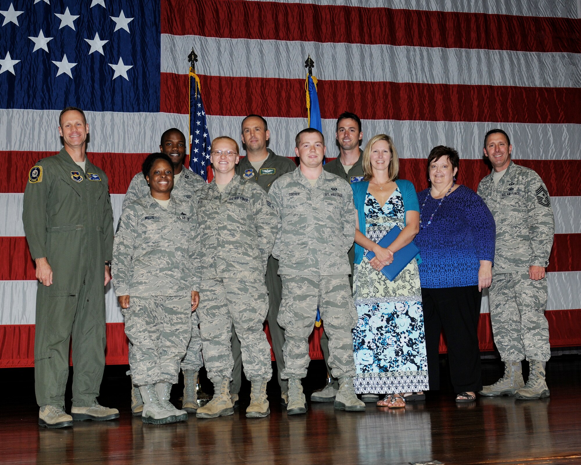 The 2014 first quarterly awards winners or their representatives pause for a photo on stage at Kaye Auditorium April 22. (U.S. Air Force Photo/Melissa Doublin)