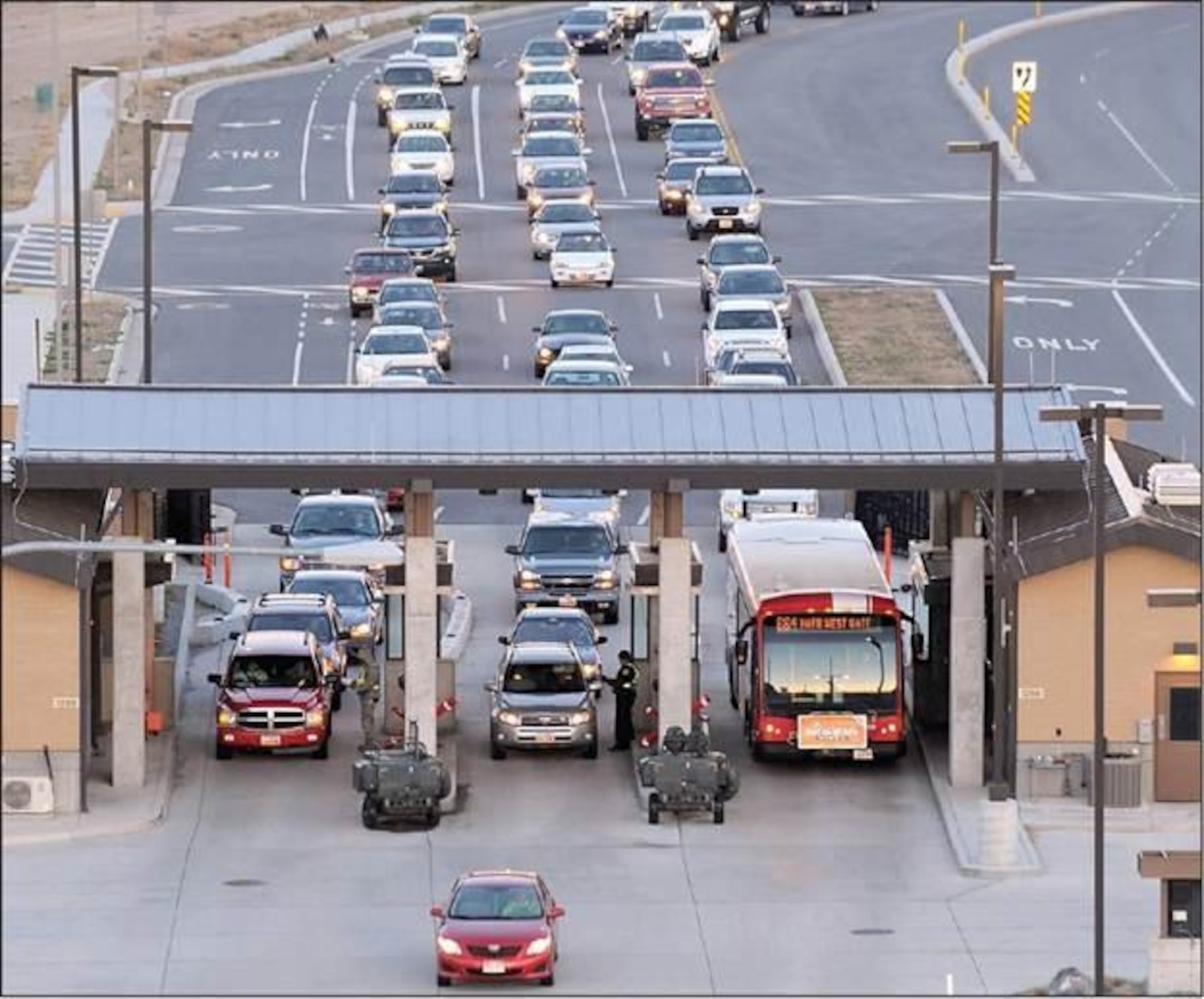 A bus enters the Hill Air Force Base West Gate April 14. Utah Transit Authority, or UTA, began a new bus service into the base, which runs Monday through Friday with two bus routes that originate from the Clearfield FrontRunner Station, running from 5 a.m. to 8 a.m. and 2:30 p.m. until 5:30 p.m. There are eight on-base stops along Route 664, the West Gate bus, and 15 on-base stops along Route 665, the South Gate bus. Go to rideuta.com for more information. (U.S. Air Force photo by Todd Cromar)