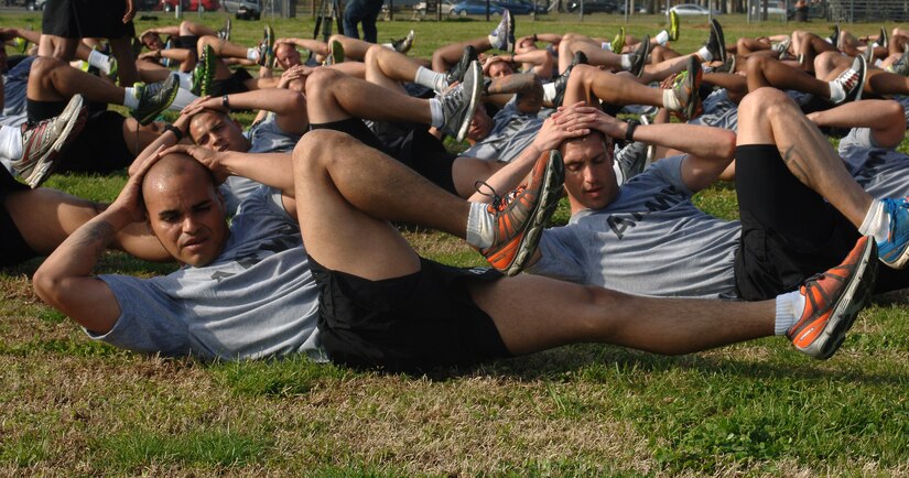 U.S. Army Soldiers perform supine bicycles during a group physical training session at Fort Eustis, Va., April 22, 2014. Soldiers attended a four-week Army Physical Readiness Training Leader Course led by a mobile training team from the U.S. Army Physical Fitness School in the hopes of becoming master fitness trainers. (U.S. Air Force photo by Senior Airman Teresa J.C. Aber/Released)