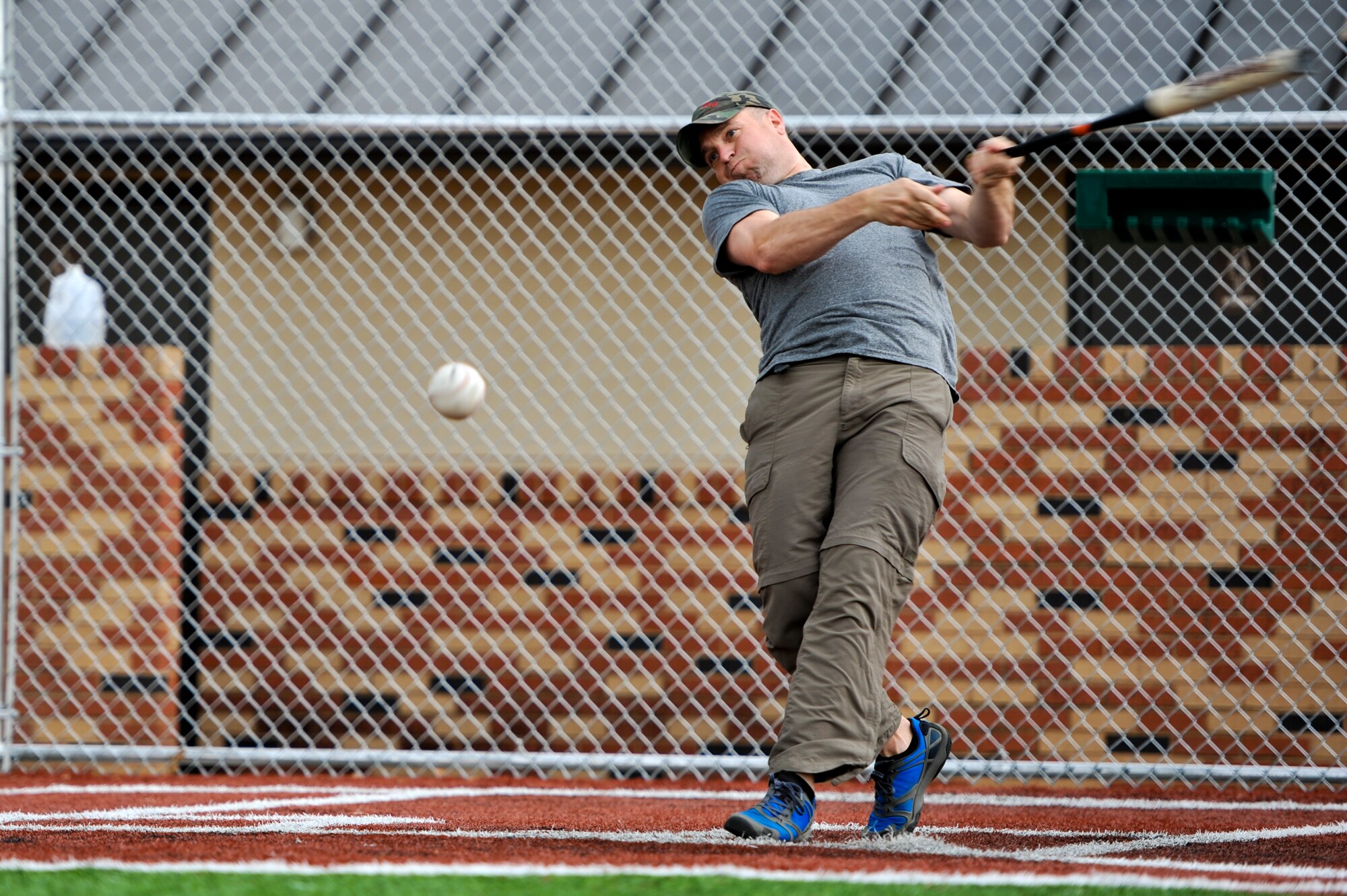 GOODFELLOW AIR FORCE BASE, Texas – 2nd Lt. Matt J. Diede, 315th Training Squadron student, hits a softball at the Mathis Fitness Center’s multipurpose field during a home run derby here April 19. The player with the most home runs won a softball bat, a batting glove and a gift card. (U.S. Air Force photo/ Airman 1st Class Boyer)