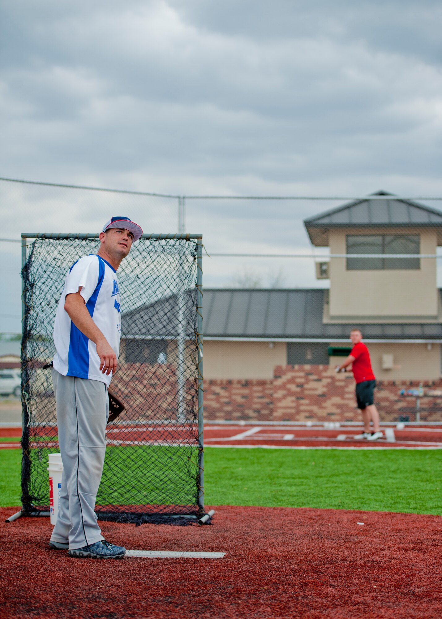 GOODFELLOW AIR FORCE BASE, Texas – Master Sgt. John E. Gregg, 17th Medical Group unit training manager, watches a softball soar overhead at the Mathis Fitness Center’s multipurpose field during a home run derby here April 19. The ball had to clear the fence in order to count as a home run. (U.S. Air Force photo/ Airman 1st Class Devin Boyer)