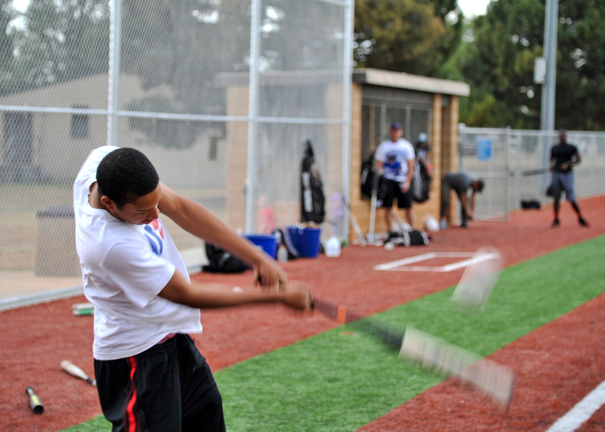 GOODFELLOW AIR FORCE BASE, Texas – Airman Antonio McDuffie, 315th Training Squadron student, hits a softball at the Mathis Fitness Center’s multipurpose field during a home run derby here April 19. The player with the most home runs won a softball bat, a batting glove and a gift card. (U.S. Air Force photo/ Airman 1st Class Boyer)