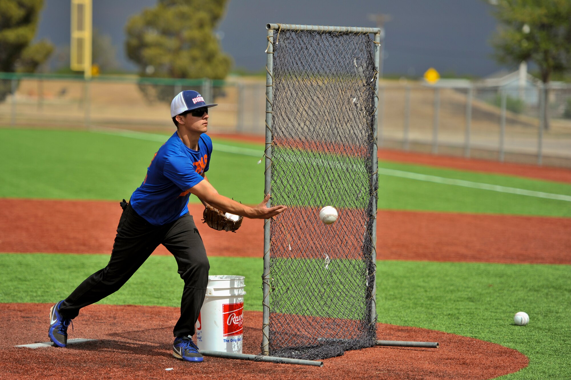 GOODFELLOW AIR FORCE BASE, Texas – Senior Airman Nathan N. Wemhoff, 17th Medical Group Aerospace medical technician, pitches a softball at the Mathis Fitness Center’s multipurpose field during a home run derby here April 19. The home run derby consisted of two rounds, a preliminary round and a final round. The player with the most home runs in the final round claimed first place. (U.S. Air Force photo/ Airman 1st Class Devin Boyer)