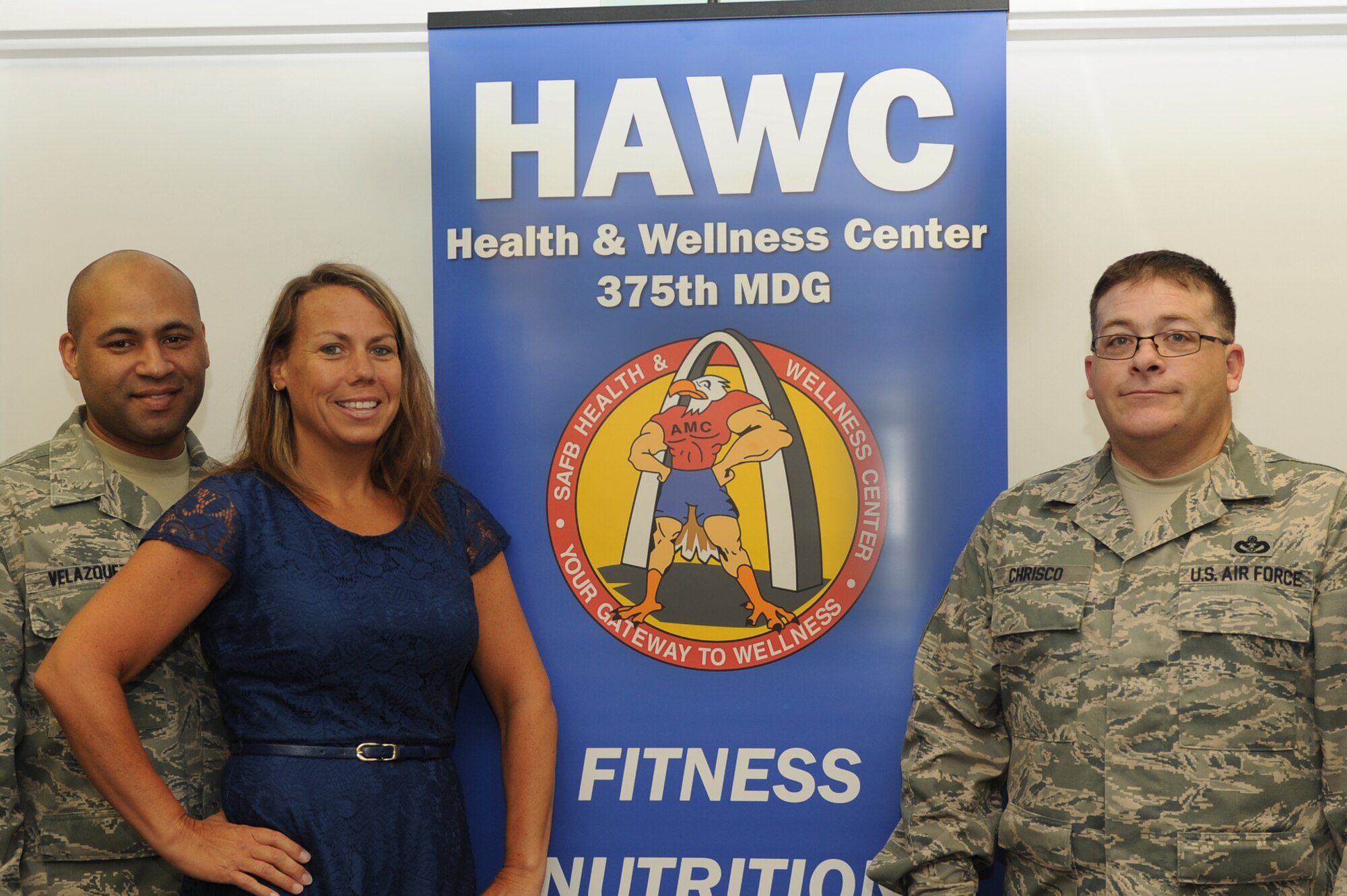140417-F-XS965-004: Master Sgt. Angel Velazquez, 375th Civil Engineer Squadron NCO in-charge of pavements and grounds, Kym Velazquez, U.S. Transportation Command and Defense Information Systems Agency management assistant, and Master Sgt. Dan Chrisco, 375th CES NCOIC of utilities systems won the Biggest Loser 5 Challenge and were recognized April 17, 2014 at the Health and Wellness Center at Scott Air Force Base, Ill. Kym Velazquez won the challenge as an individual and they placed second as a team. (U.S. Air Force photo by Senior Airman Sarah Hall-Kirchner)