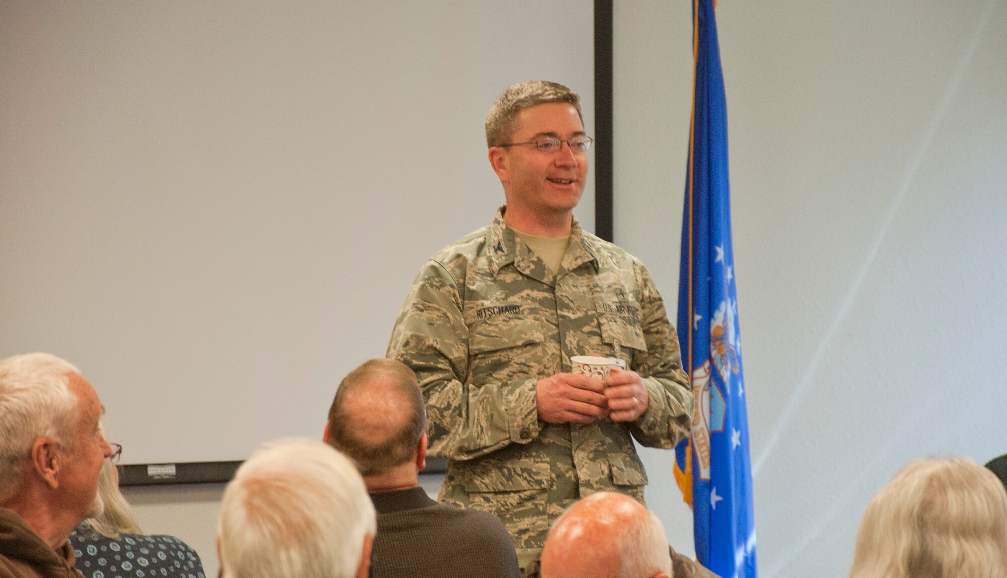 140419-F-GZ967-014 Col. Hans Ritschard, 90th Medical Group commander, speaks to the assembled retirees in the conference room of the 90th MDG Medical Treatment Facility April 19 during the Retiree Appreciation Day event. Ritschard explained various changes the medical group is making in hopes of providing better service to retirees in the area, including re-enrolling retirees to be treated at the MTF. (U.S Air Force photo by Airman 1st Class Brandon Valle)