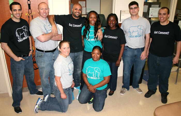 Naval Health Clinic Charleston Sailors and civilians wore their jeans to work as part of the Denim Day campaign. The Denim Day campaign began after the Italian Supreme Court overturned a rape conviction. The justices ruled the rape victim was wearing tight jeans that could only she could remove, thereby implying consent. The following day, the women in the Italian Parliament came to work wearing jeans in solidarity with the victim. Since then, wearing jeans on Denim Day has become a symbol of protest against erroneous and destructive attitudes about sexual assault. Front row: Lt. Lauren Brown, Petty Officer 2nd Class Loveann Burch. Back row: John McGinniss, Petty Officer 1st Class Hutcheson, Petty Officer 2nd Class Paul Veiga, Petty Officer 2nd Class Courtney Veiga, Sonya Fortner-Riley, Petty Officer 3rd Class Christopher Crowley and Petty Officer 3rd Class Keith Jenkins. (U.S. Navy photo/Kris Patterson)

