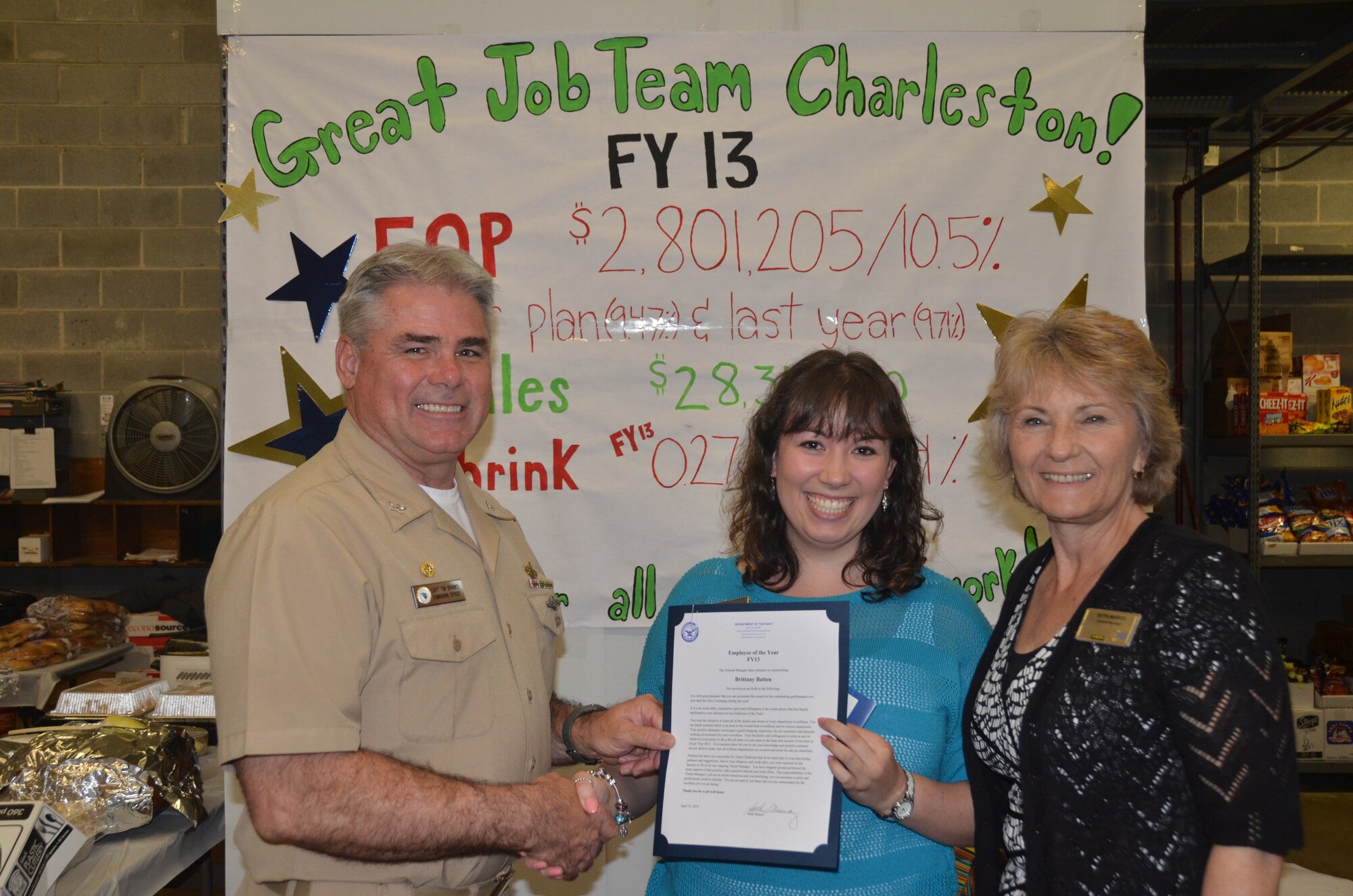 Capt. Timothy Sparks, Naval Support Activity commanding officer and Beth Munoz, Navy Exchange general manager, congratulate Brittany Batten, the 2013 NEX Employee of the Year, during the NEX annual award ceremony April 23, 2014, at Joint Base Charleston. The NEX earned $851,000 for Morale, Welfare and Recreation on sales of more than $28 million. Also recognized at the ceremony were Bveverly Nealy, Employee of the Quarter, JoAnne Chambers, 25 years of service, Josafina Gaza and Rose Hartselle, 10 years of service and Tina Dennis, five years of service; Letters of Appreciation were given to Carol Austin, Pamela Tarpley, Bernice Mack, Janice Green, Jon Rosinus, Margaret Teague, Anthony Hopson, Betty Anderson, Britney Allen, Dee Drury, Penny Chestnut, Sandra Kasten, Gale Washington, Brittany Batten and Brandi Shah; Letters of Recognition were given to Craig Jones, Betty Anderson, Britney Allen and Jane Sonoda; Safety Recognition letters were presented to Rebecca Glover, Jordan Harkless, Beverly Nealy, Patricial Allen, Ashleigh Eagle, Amanda Shamess, Audrey Bryant, Ida Denmark, Leslie Schaill, Rosemarie Harsell, Pam Smalls and Darlene Warso. Peter Johnson was presented with the Customer Service Peer Award. (U.S. Air Force photo/Eric Sesit)