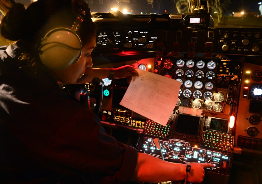 U.S. Air Force Senior Airman Alexis Martinez, 100th Aircraft Maintenance Squadron crew chief from Los Angeles, begins the refueling of a KC-135 Stratotanker April 17, 2014, on RAF Mildenhall, England. While on the ground, KC-135s receive fuel from pumps scattered around the taxiways. (U.S. Air Force photo by Airman 1st Class Dillon Johnston/Released)