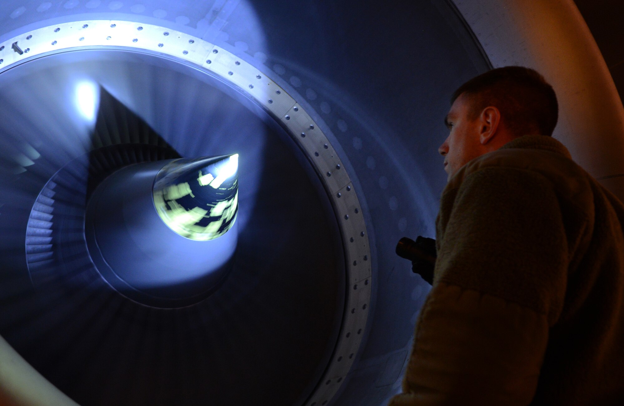 U.S. Air Force Staff Sgt. Kyle Nickels, 100th Aircraft Maintenance Squadron crew chief from Troy, Ohio, inspects the engine of a KC-135 Stratotanker April 17, 2014, during a routine inspection on RAF Mildenhall, England. Crew chiefs perform inspections to ensure there are no major defects which would make the plane unfit to fly. (U.S. Air Force photo by Airman 1st Class Dillon Johnston/Released)