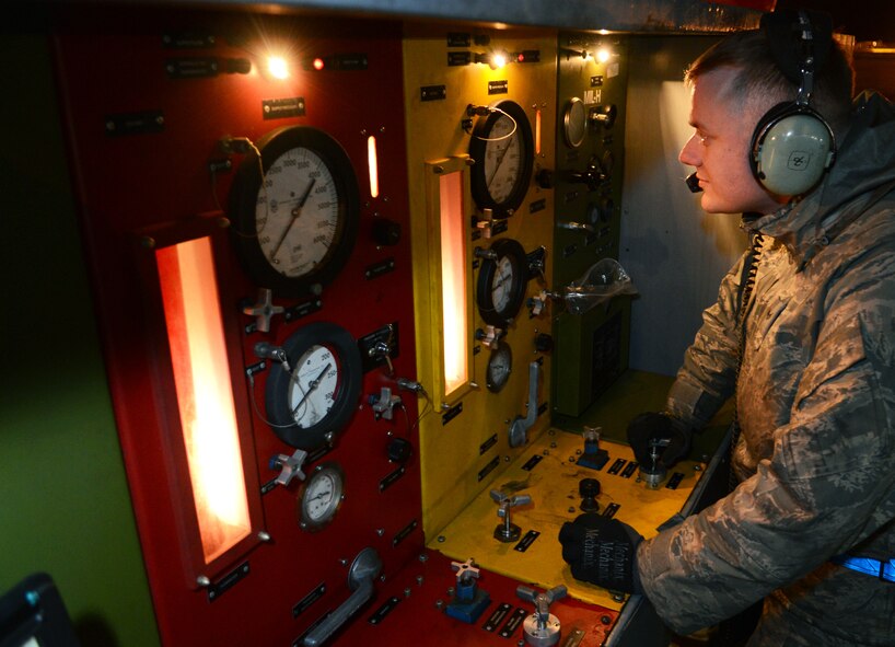 U.S. Air Force Senior Airman Seth Rheinholtz, 100th Aircraft Maintenance Squadron hydraulics journeyman from Gibsonburg, Ohio, uses a portable hydraulics test stand April 17, 2014, on RAF Mildenhall, England. A hydraulics test stand allows 100th AMXS members to test the hydraulics systems of an aircraft without turning on the engines. (U.S. Air Force photo by Airman 1st Class Dillon Johnston/Released) 