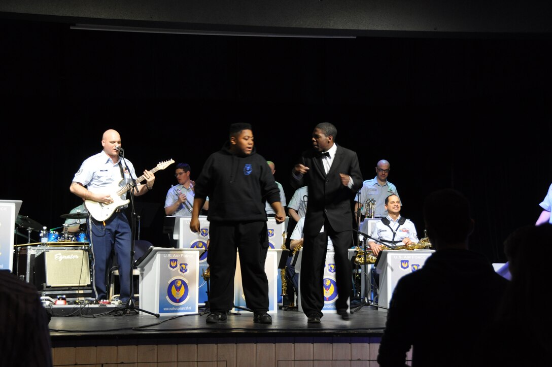 Students from Ramstein High School strut their stuff during the "Michael Jackson Medley." The Ambassadors perform annually for DODDS students during Music in Our Schools Month. (U.S. Aor Force photo/Tech. Sgt. Jeremy Nee)