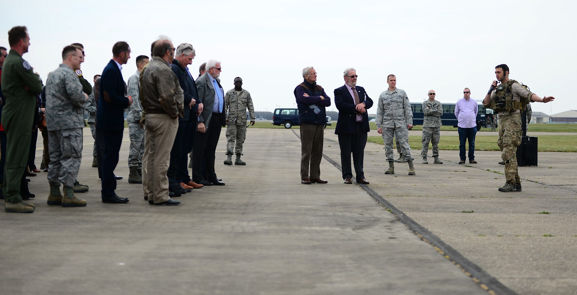 A 56th Rescue Squadron pararescue specialist narrates an exercise for honorary commanders during their visit to Royal Air Force Lakenheath, England, April 17, 2014. The honorary commanders visited as part of an outreach to understand the base’s mission and roles.  (U.S. Air Force photo by Staff Sgt. Emerson Nuñez/Released)