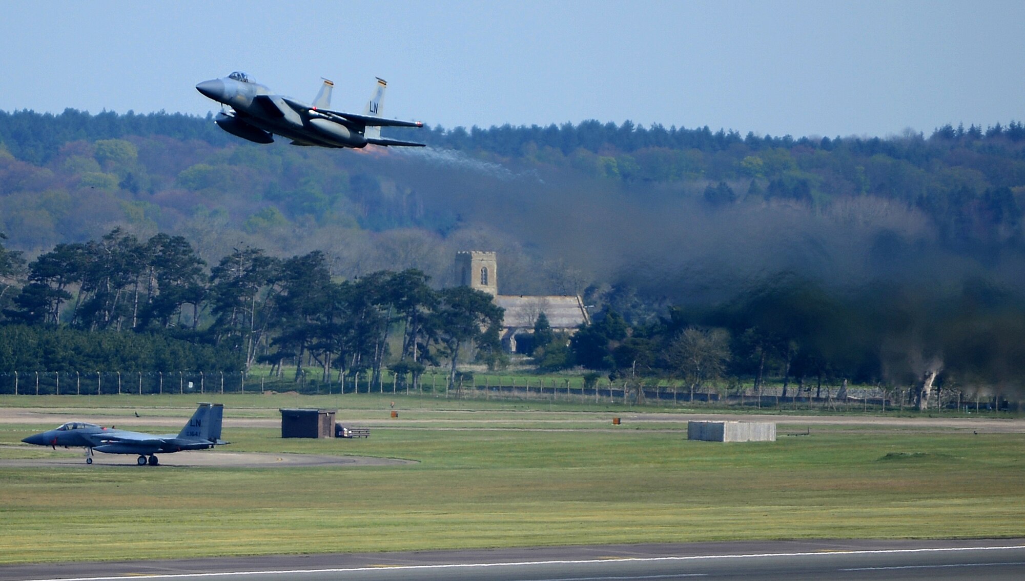 An F-15C Eagle takes flight during an honorary commander visit to Royal Air Force Lakenheath, England, April 17, 2014. Honorary commander visits are an outreach effort to help local leaders understand the base’s mission and roles.  (U.S. Air Force photo by Staff Sgt. Emerson Nuñez/Released)