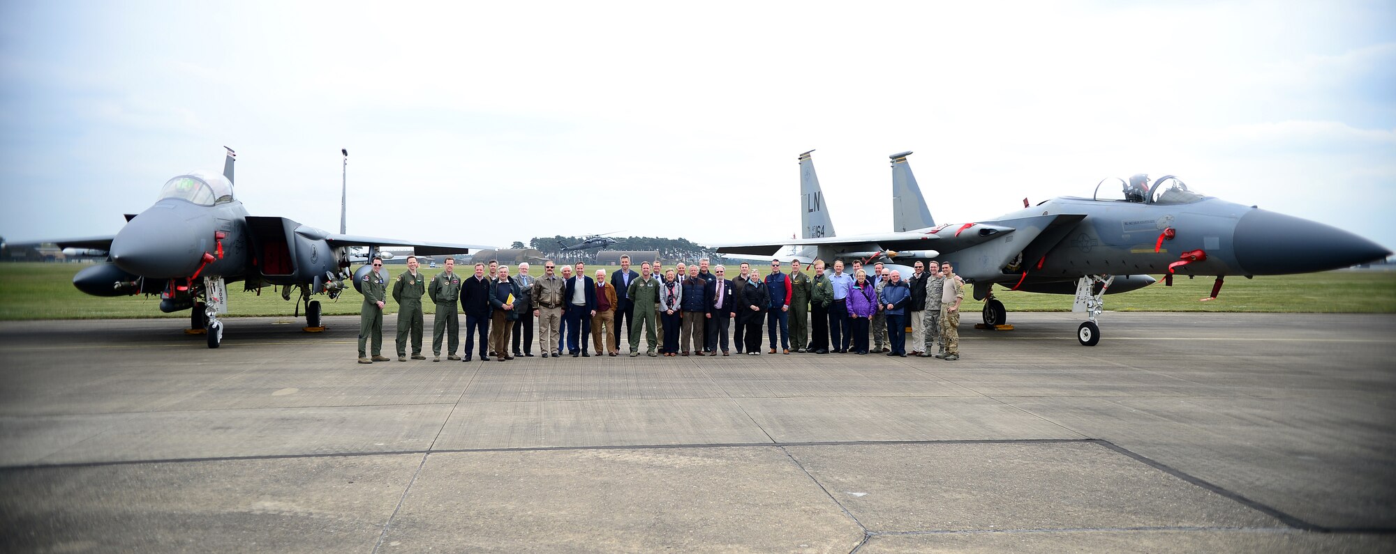 Honorary commanders pose for a group photo during their visit to Royal Air Force Lakenheath, England, April 17, 2014. Honorary commander visits are an outreach effort to help local leaders understand the base’s mission and roles. (U.S. Air Force photo by Staff Sgt. Emerson Nuñez/Released)