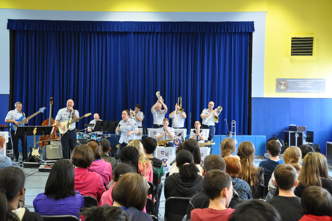 Guitarist TSgt Jason Cale entertains the students of Landstuhl Middle School on the Funk  classic "Shakey Ground."  The Ambassadors perform annually for DODDS students during Music in Our Schools Month. (U.S. Aor Force photo/Tech. Sgt. Jeremy Nee)